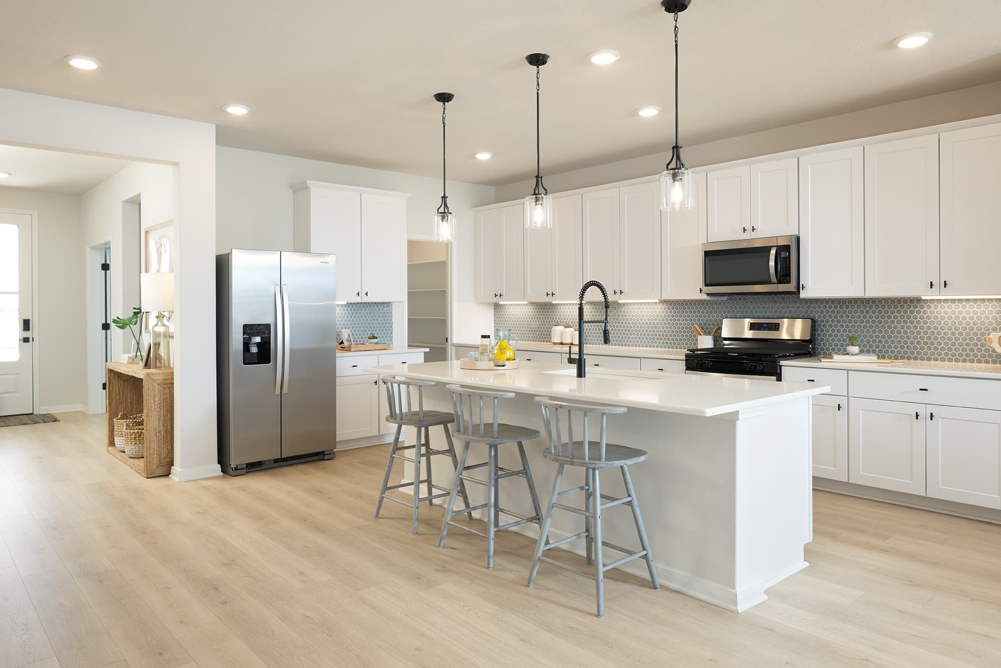 kitchen with blue backsplash & white countertops 