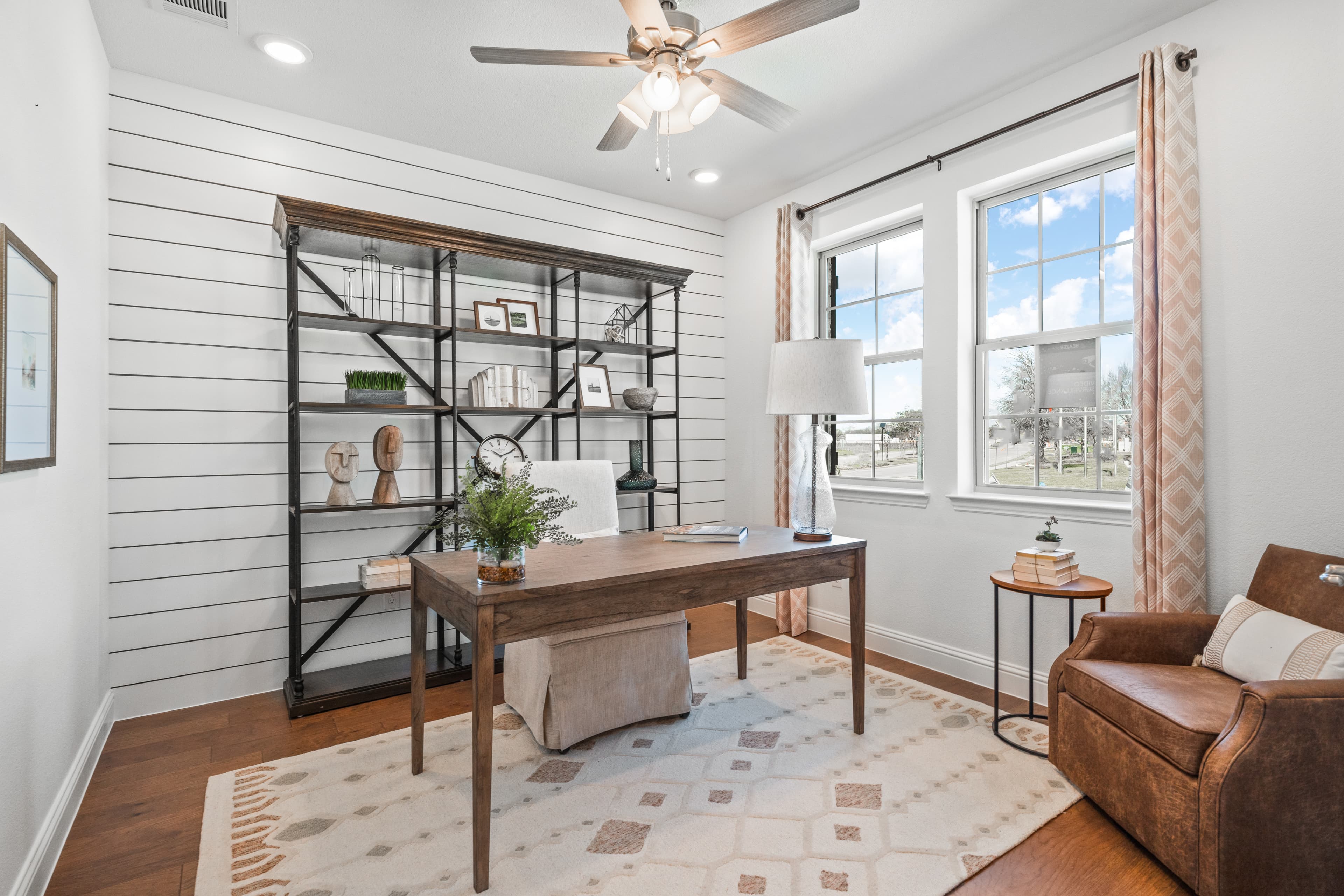 private study with french doors and wood floors