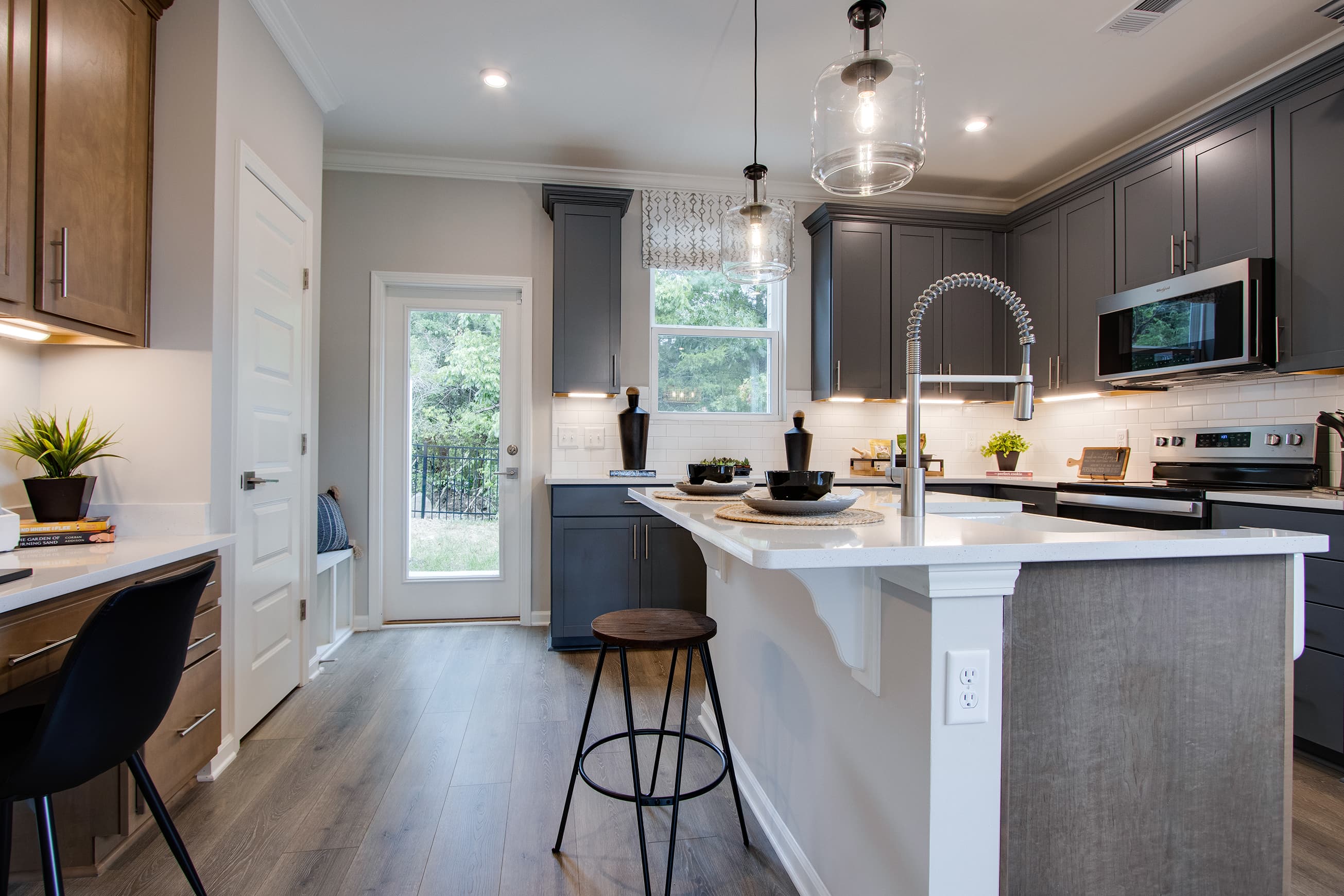 kitchen with island and dark painted cabinets