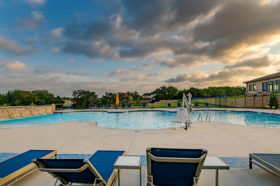 community pool with chairs