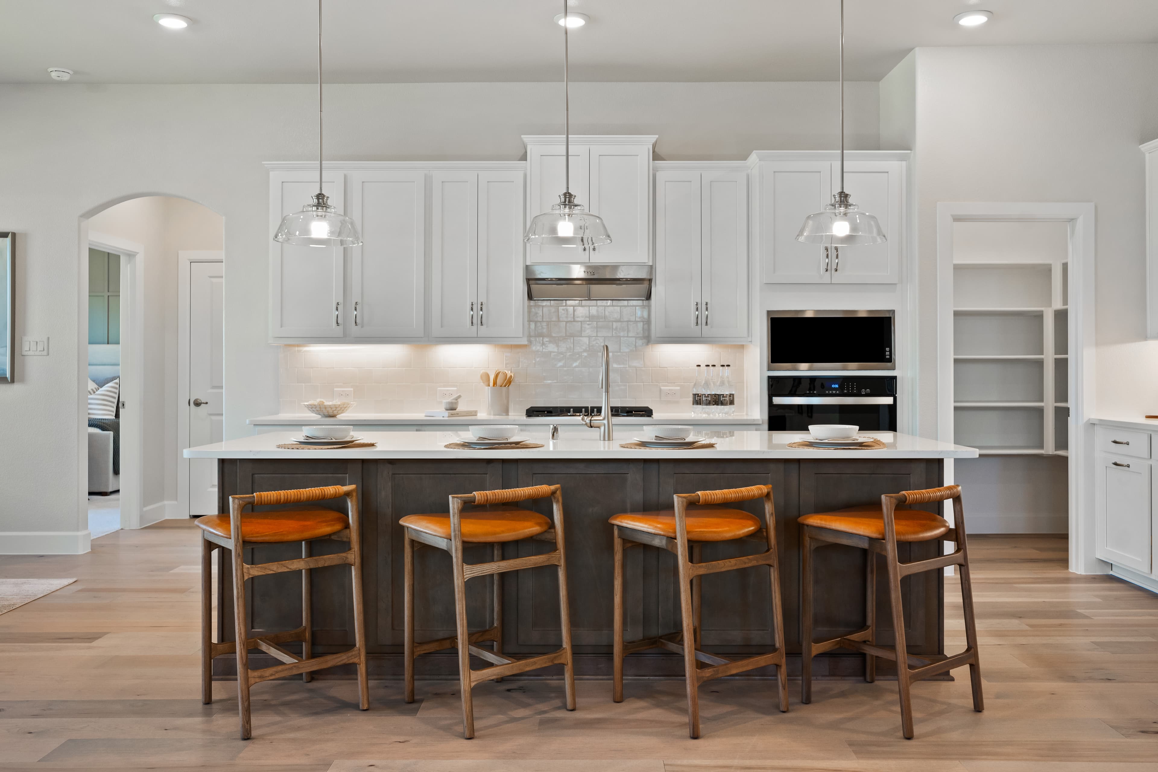 open kitchen with large island and wood floors
