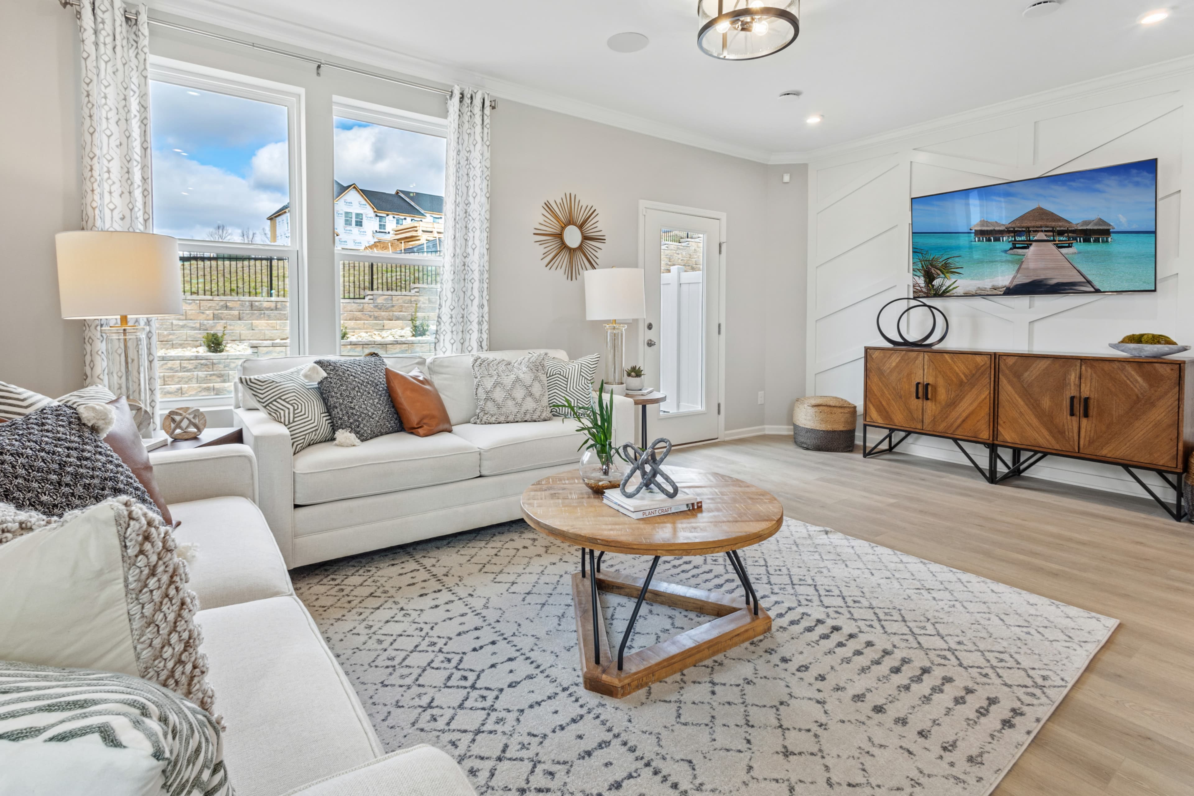 great room with couches and entertainment center