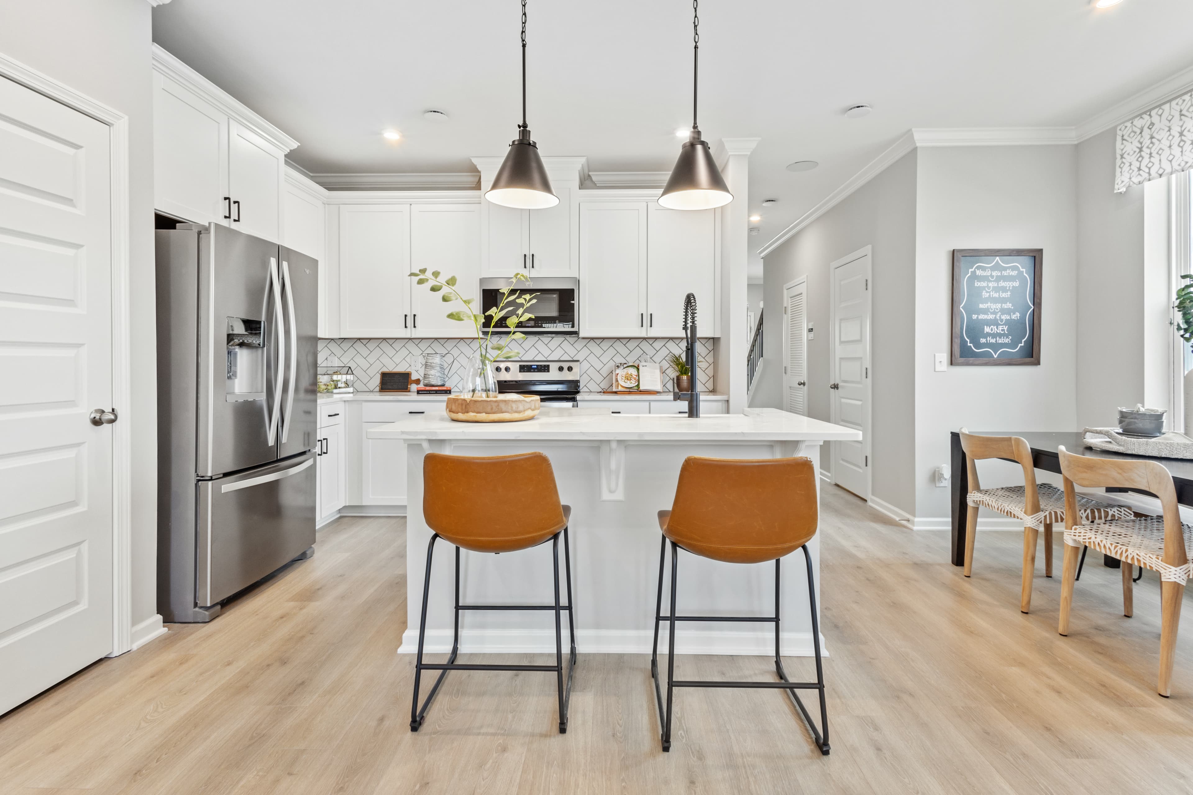 kitchen with white cabinets and backsplash