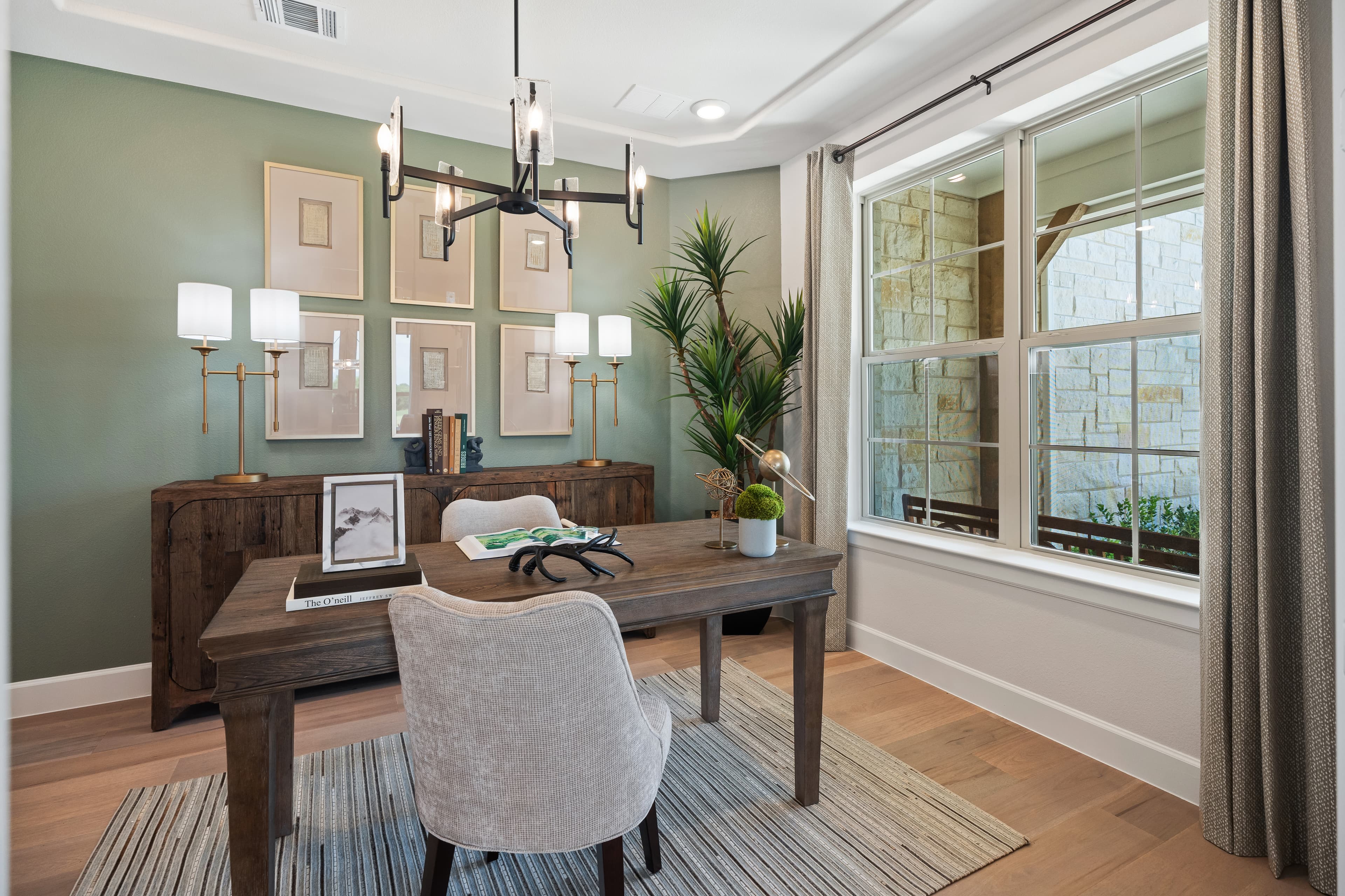 private study with large window and wood floors