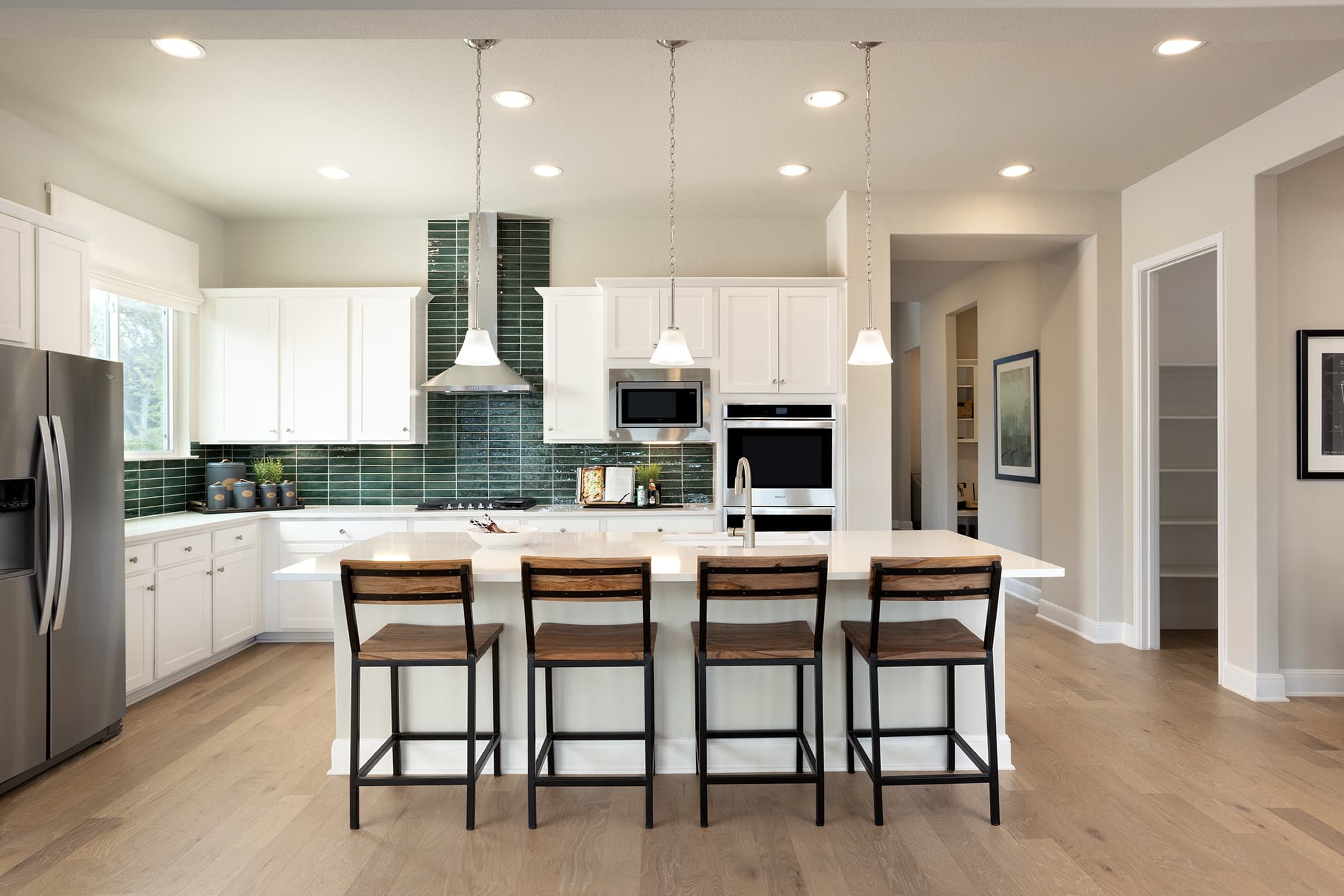 kitchen with green backsplash