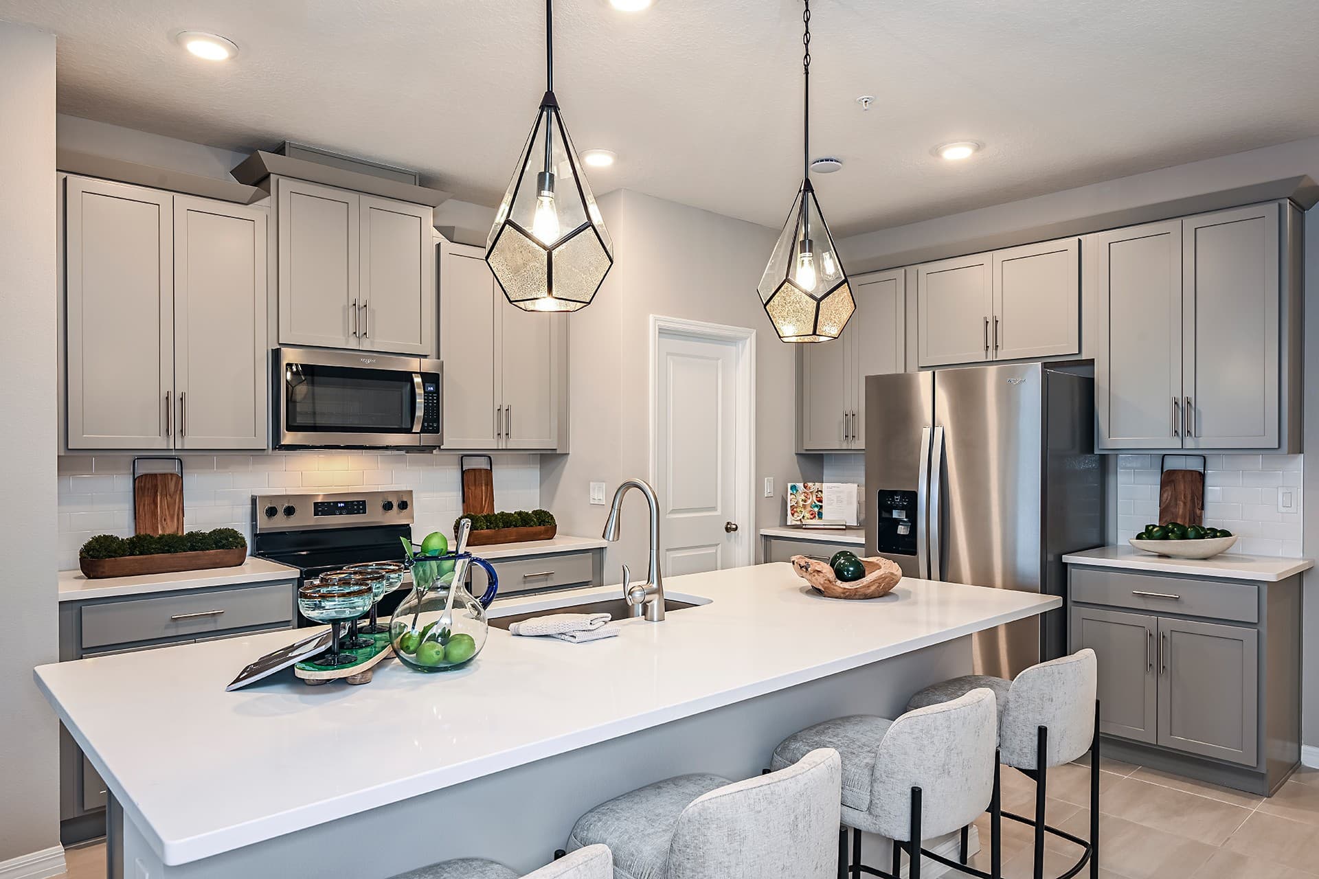 kitchen with gray cabinets and white countertops