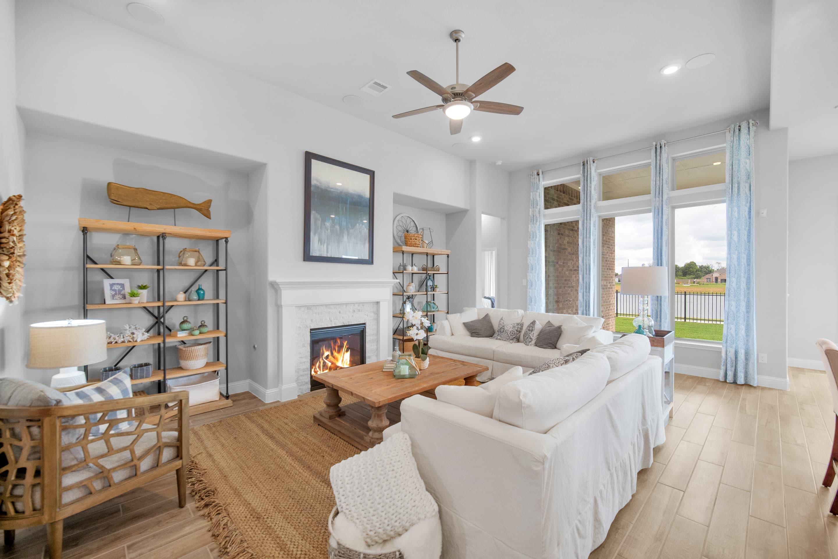 great room with hardwood floors and fireplace