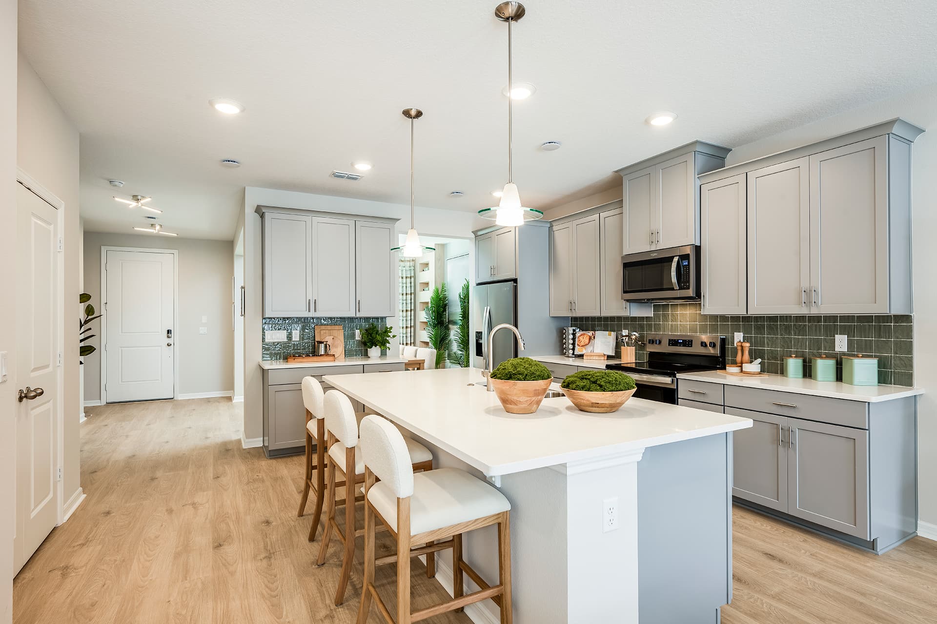 kitchen with gray cabinets and quartz countertops