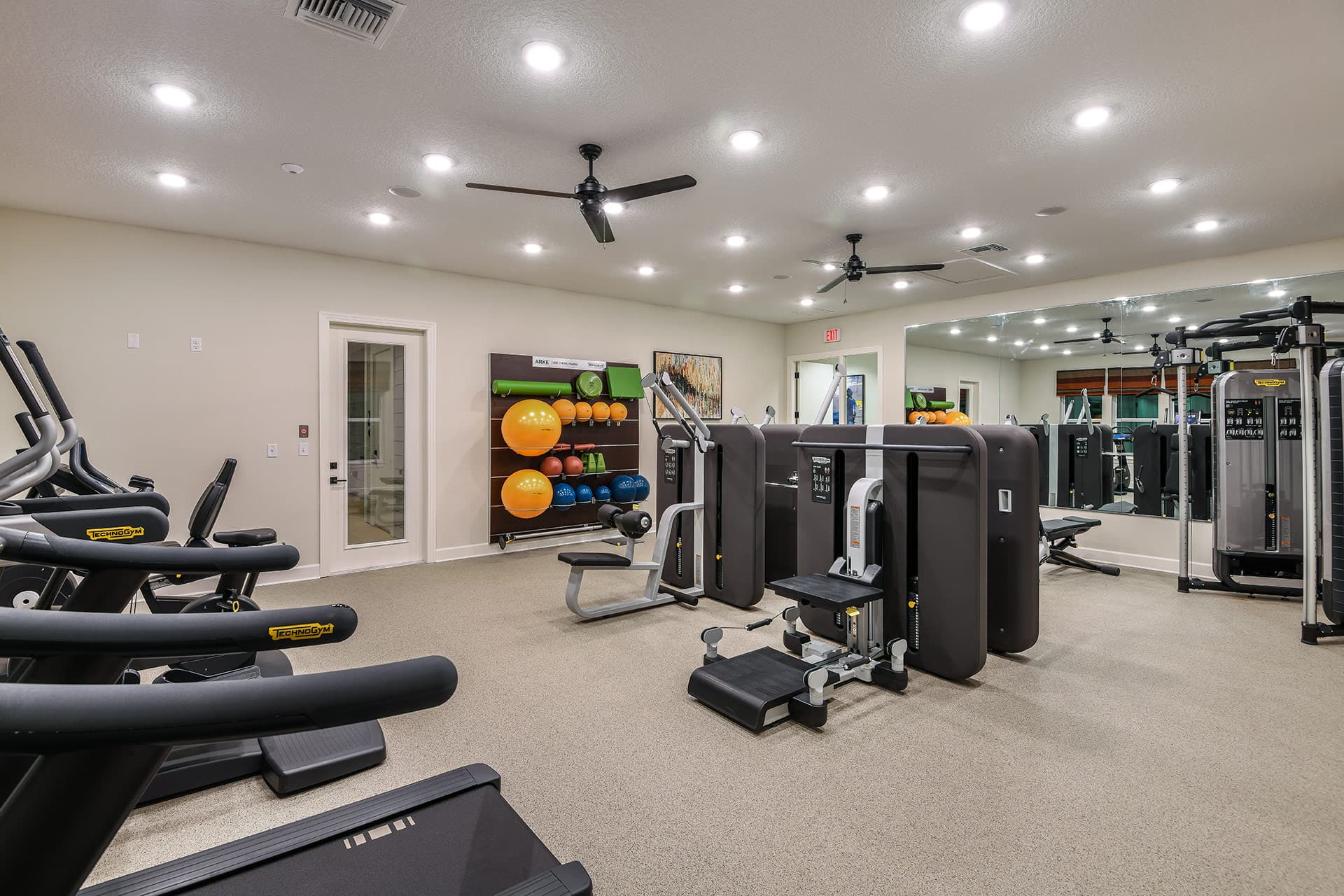 fitness center with cardio and strength machines