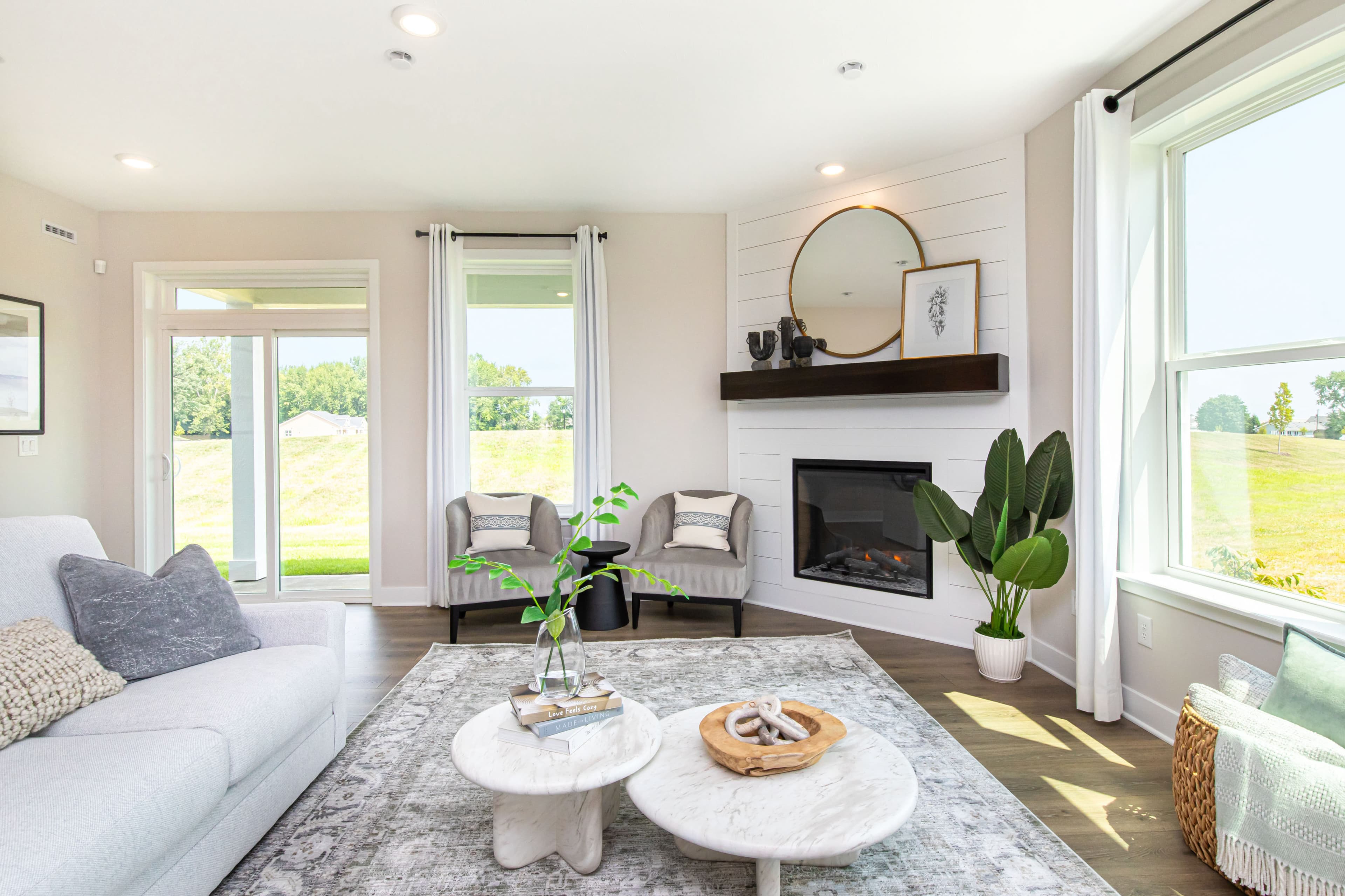 great room with white shiplap fireplace