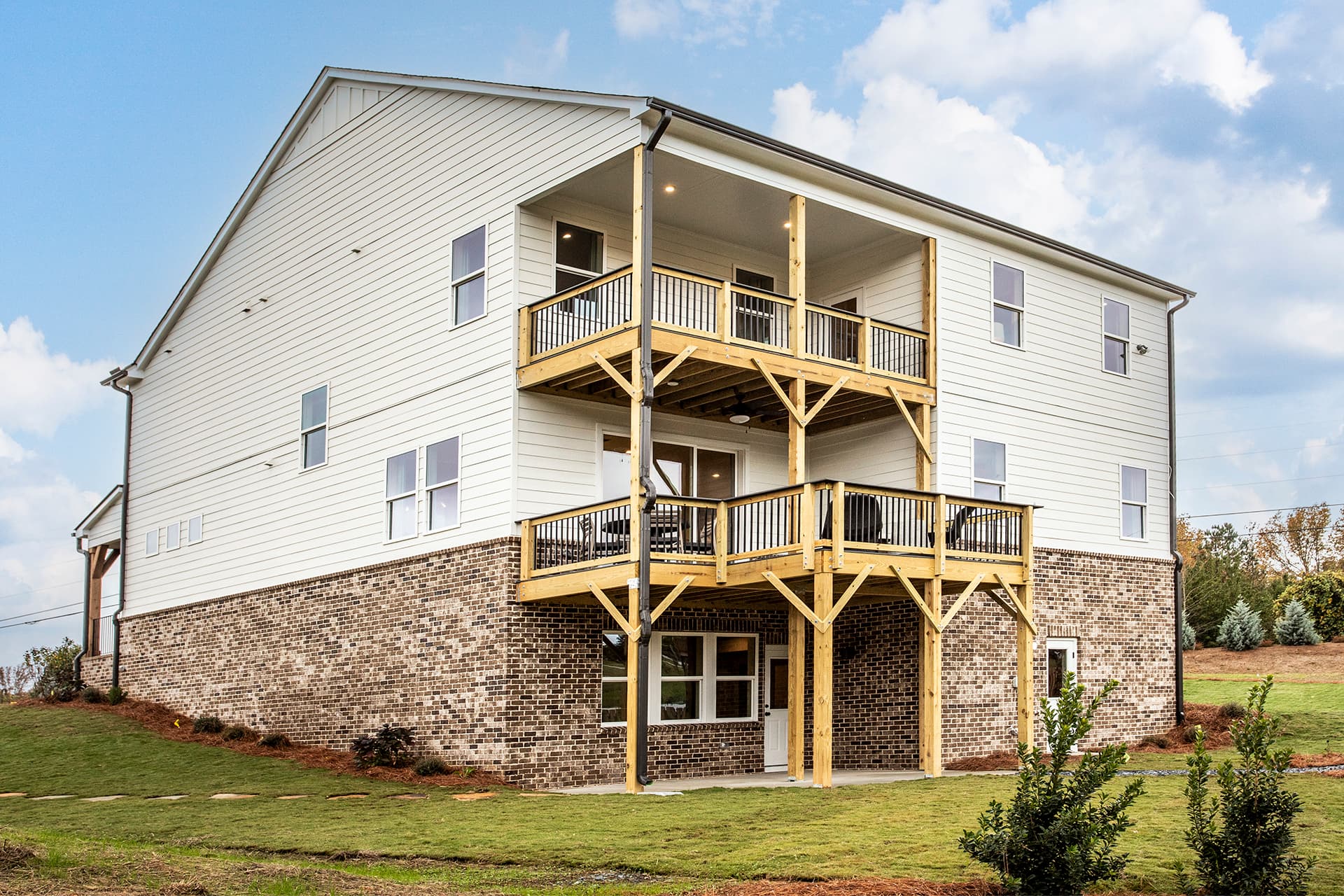 back of basement home with covered decks