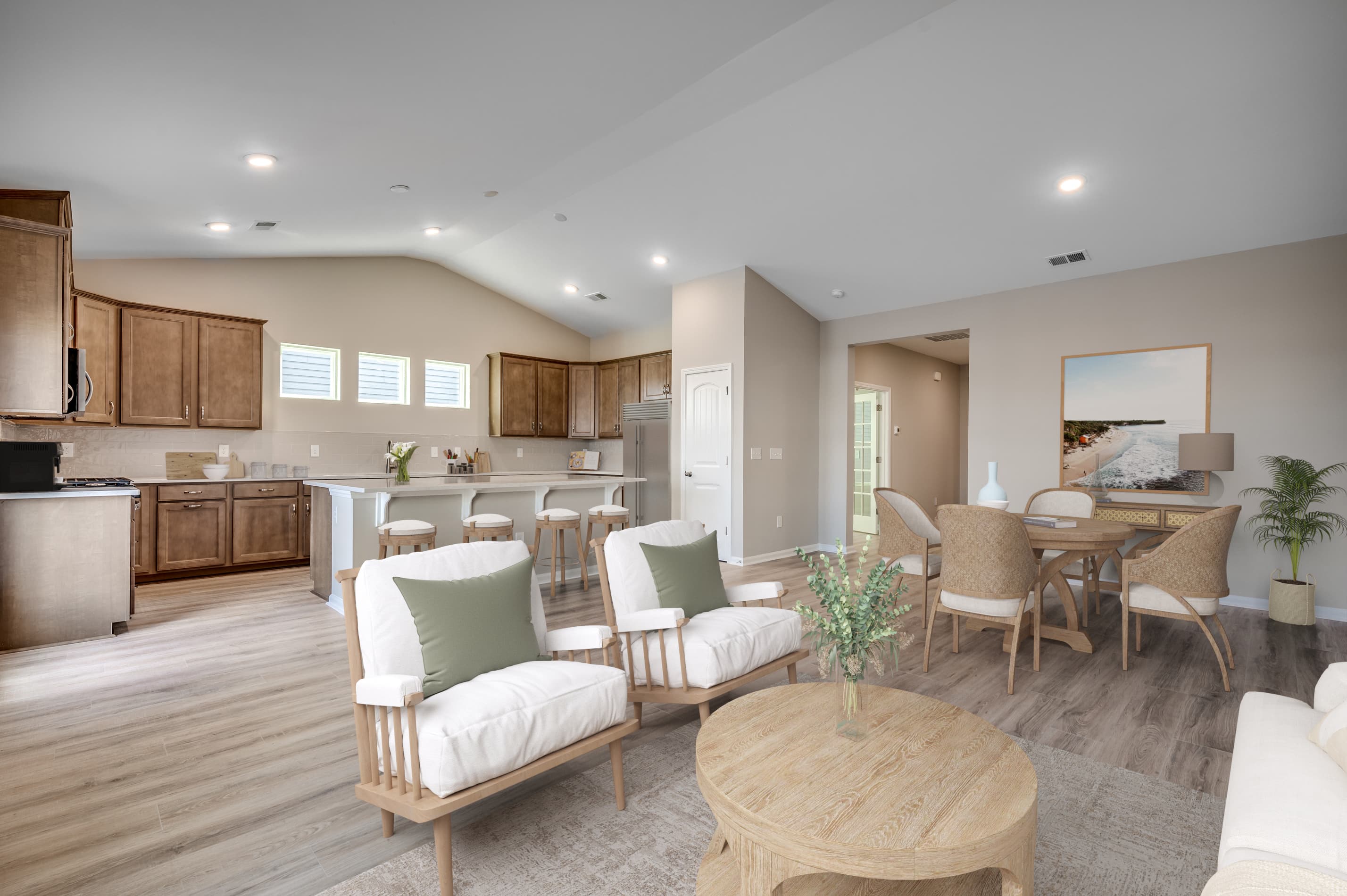 open-concept great room with hardwood floors 