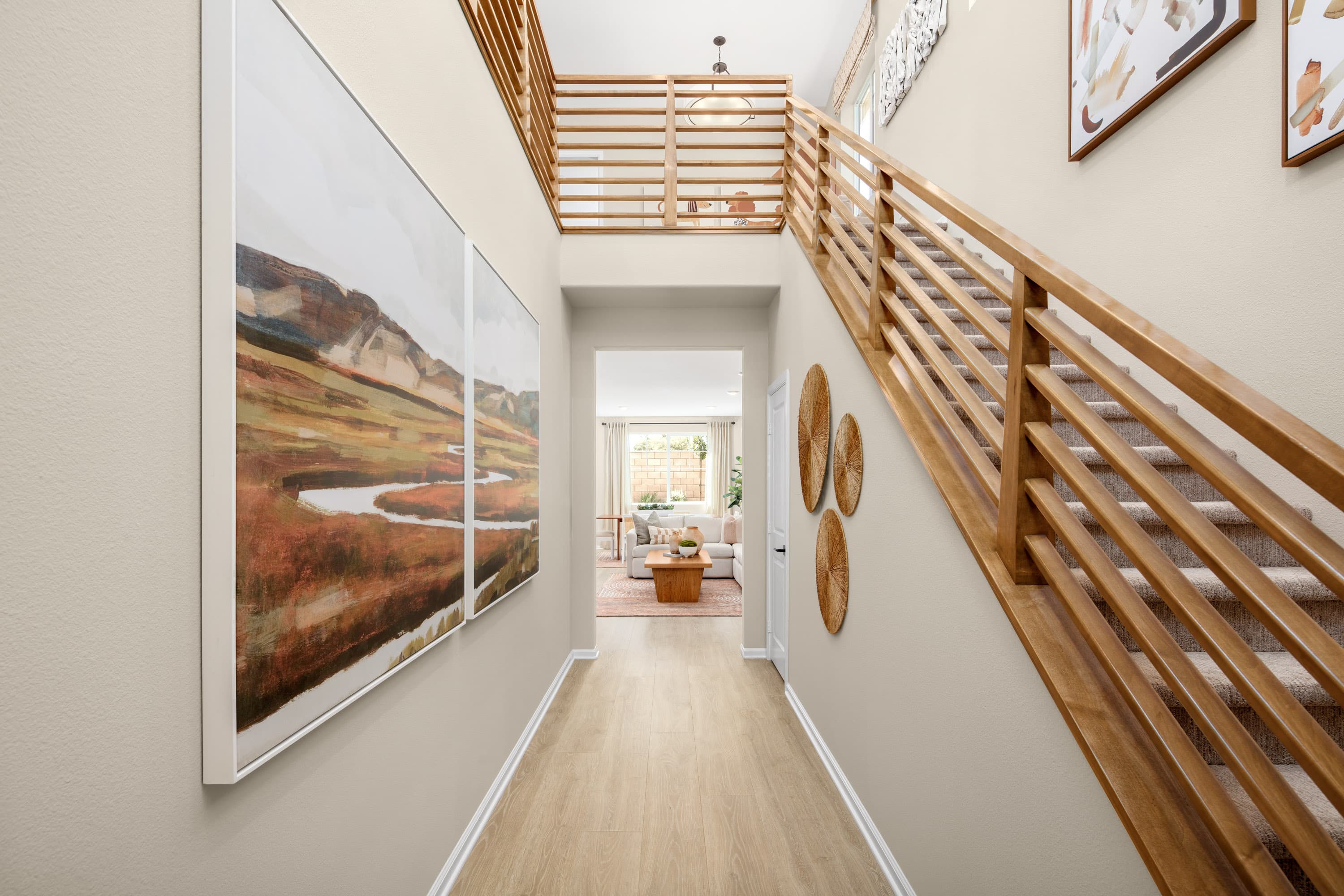 entry with art on the walls and stairs