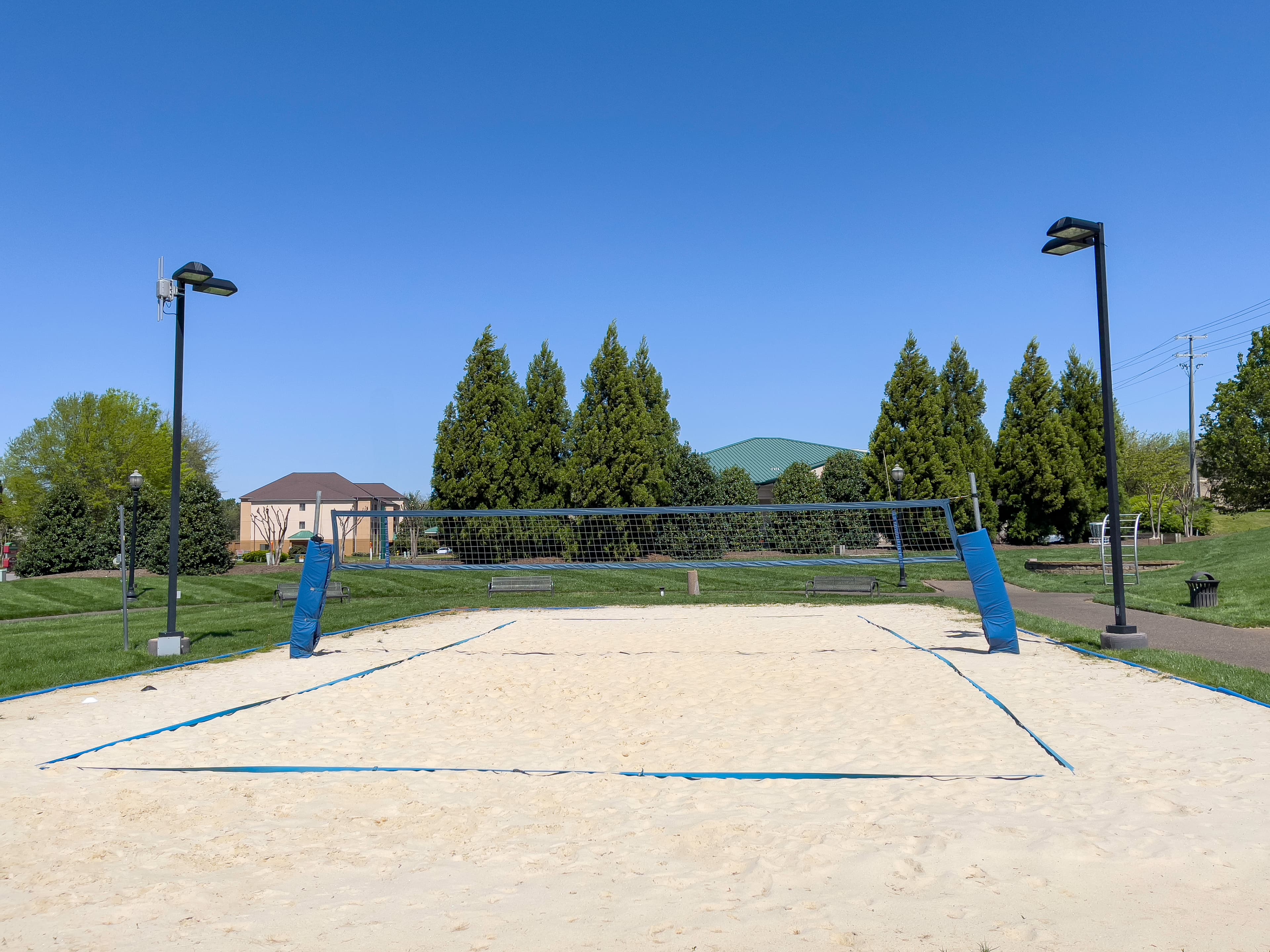volleyball court with sand and a net