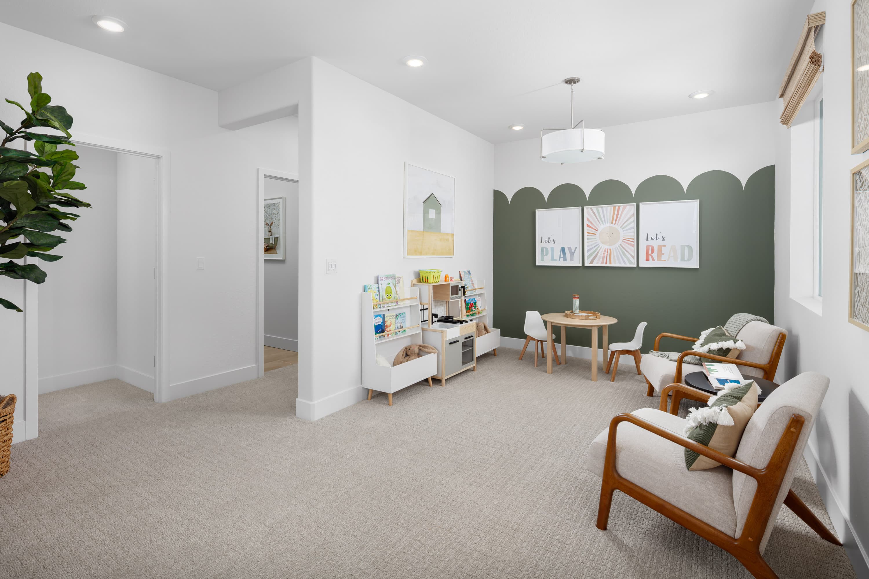 loft with green wall and kids table & chairs