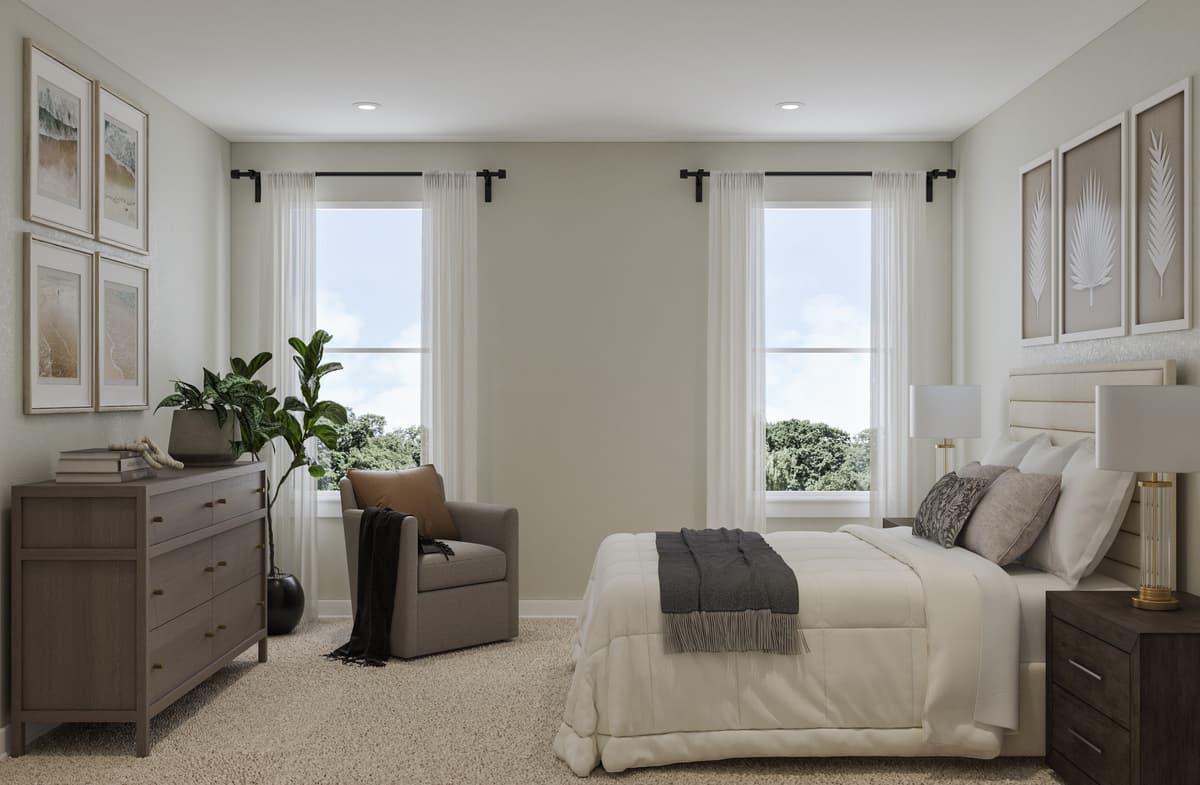 primary bedroom with a king bed and two windows 