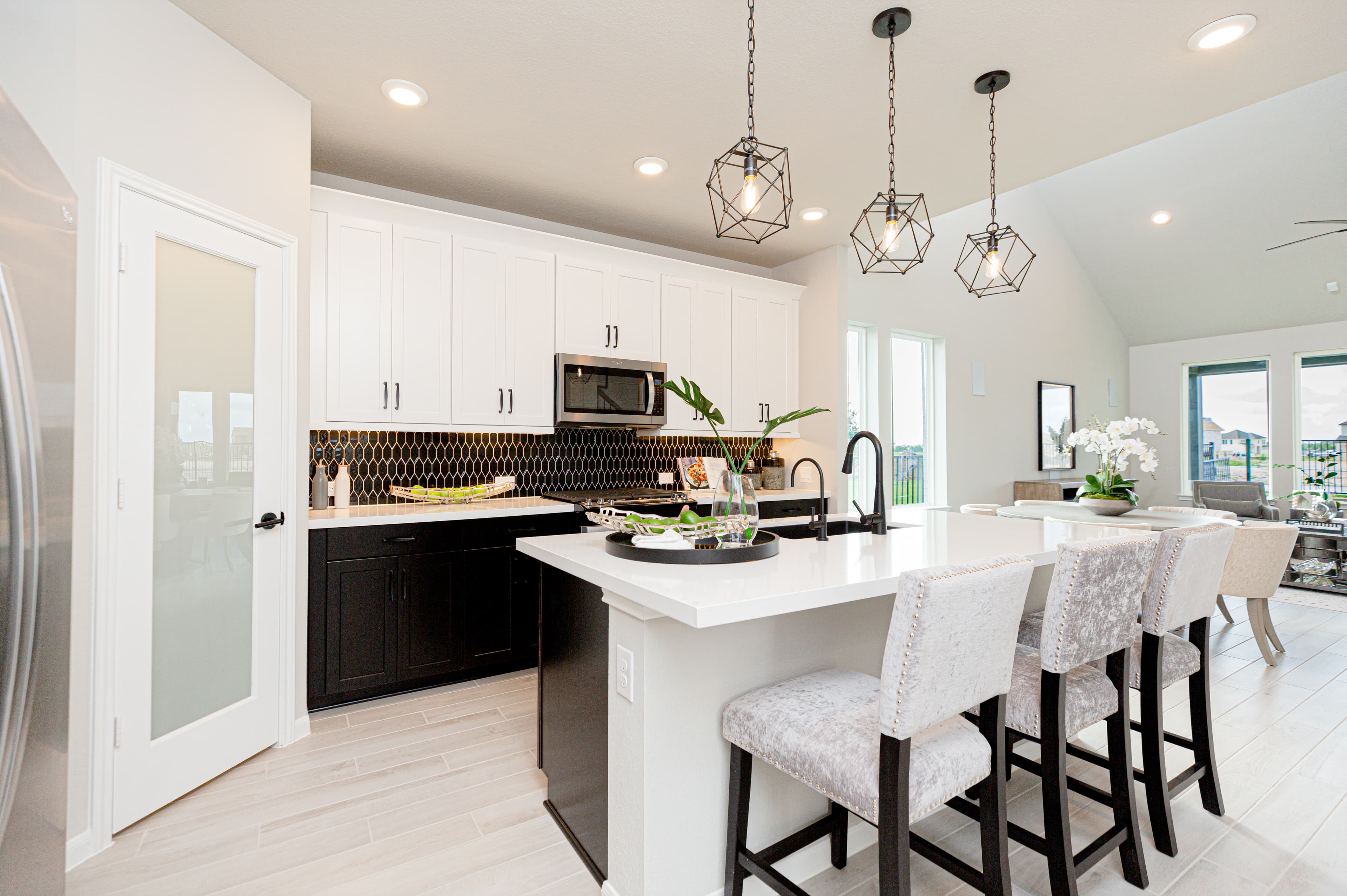 kitchen with white cabinets and pendant lighting