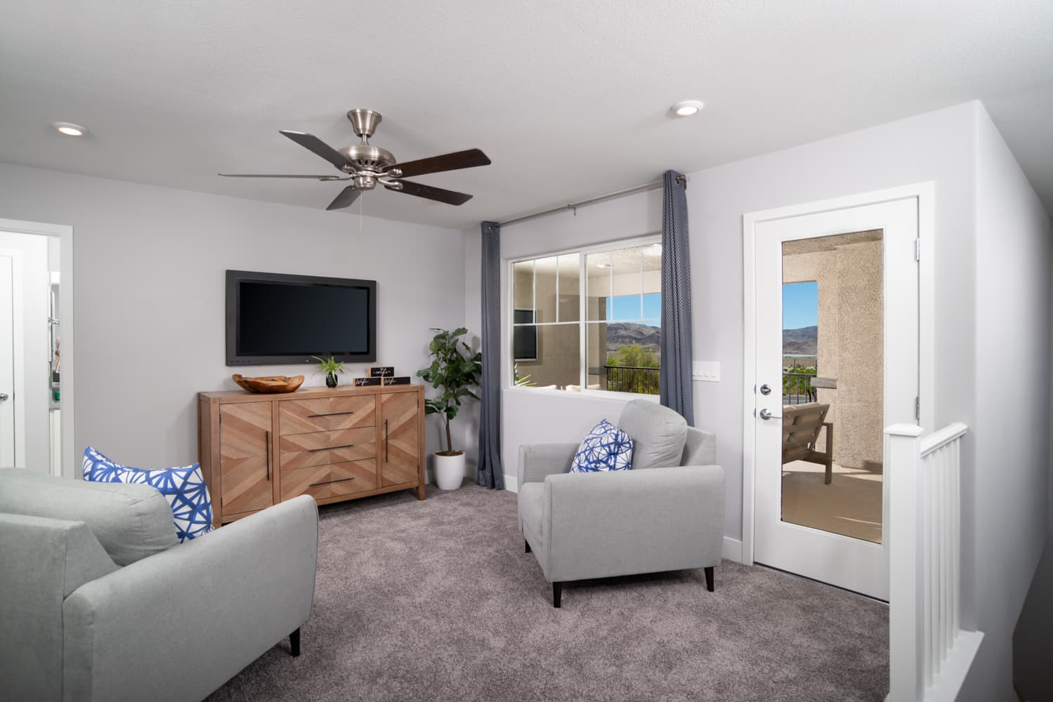 loft with ceiling fan, carpet & balcony access