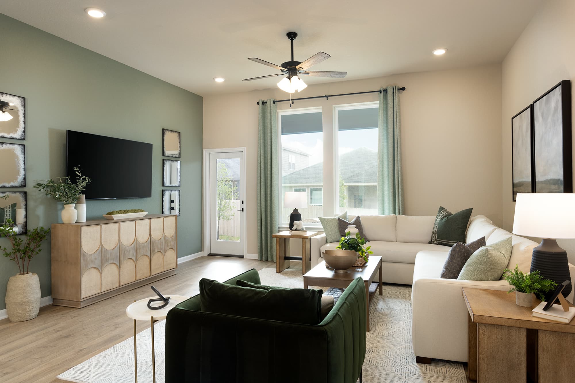great room with couch, rug & large windows