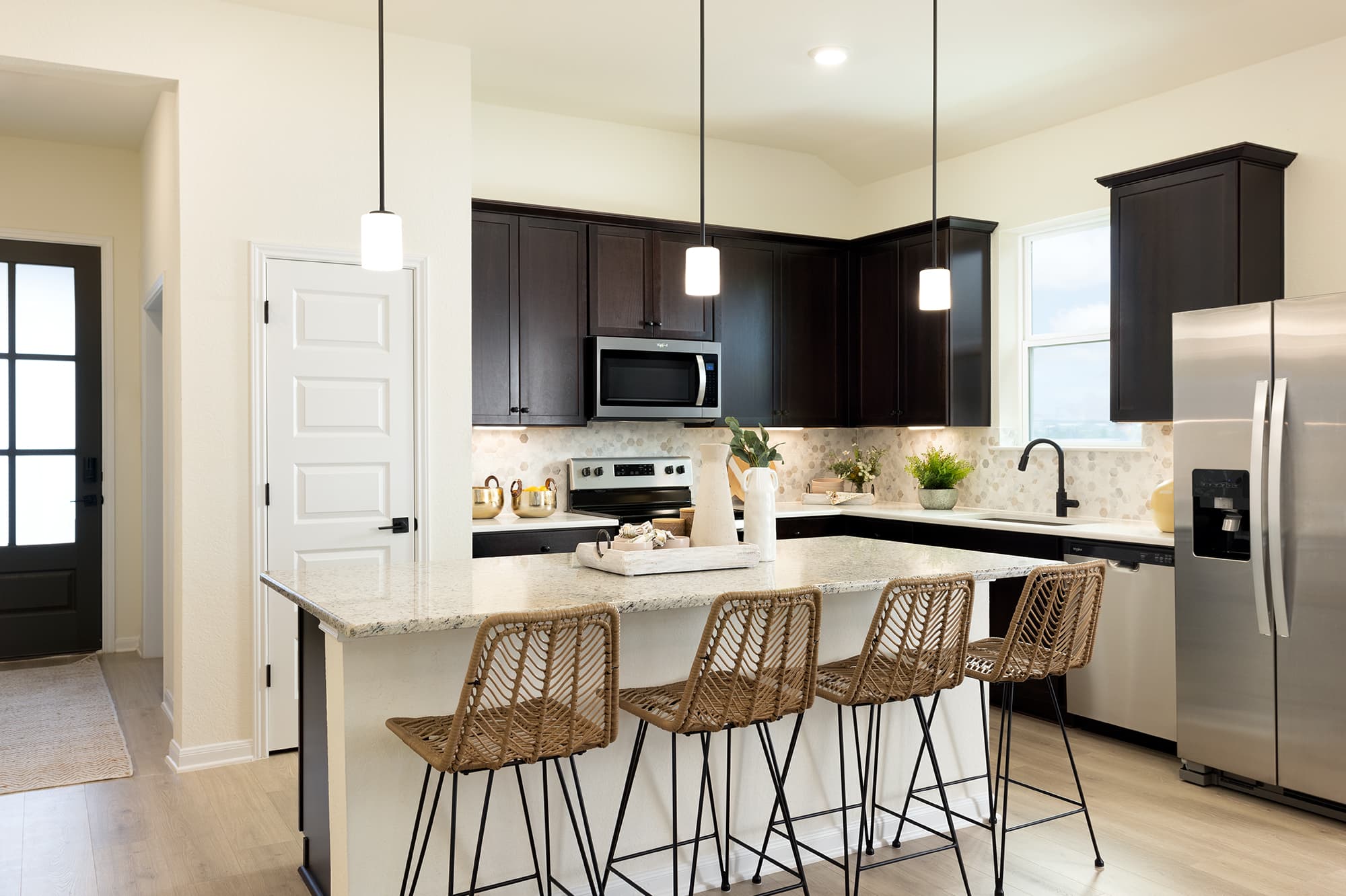 kitchen with granite countertops & brown cabinets
