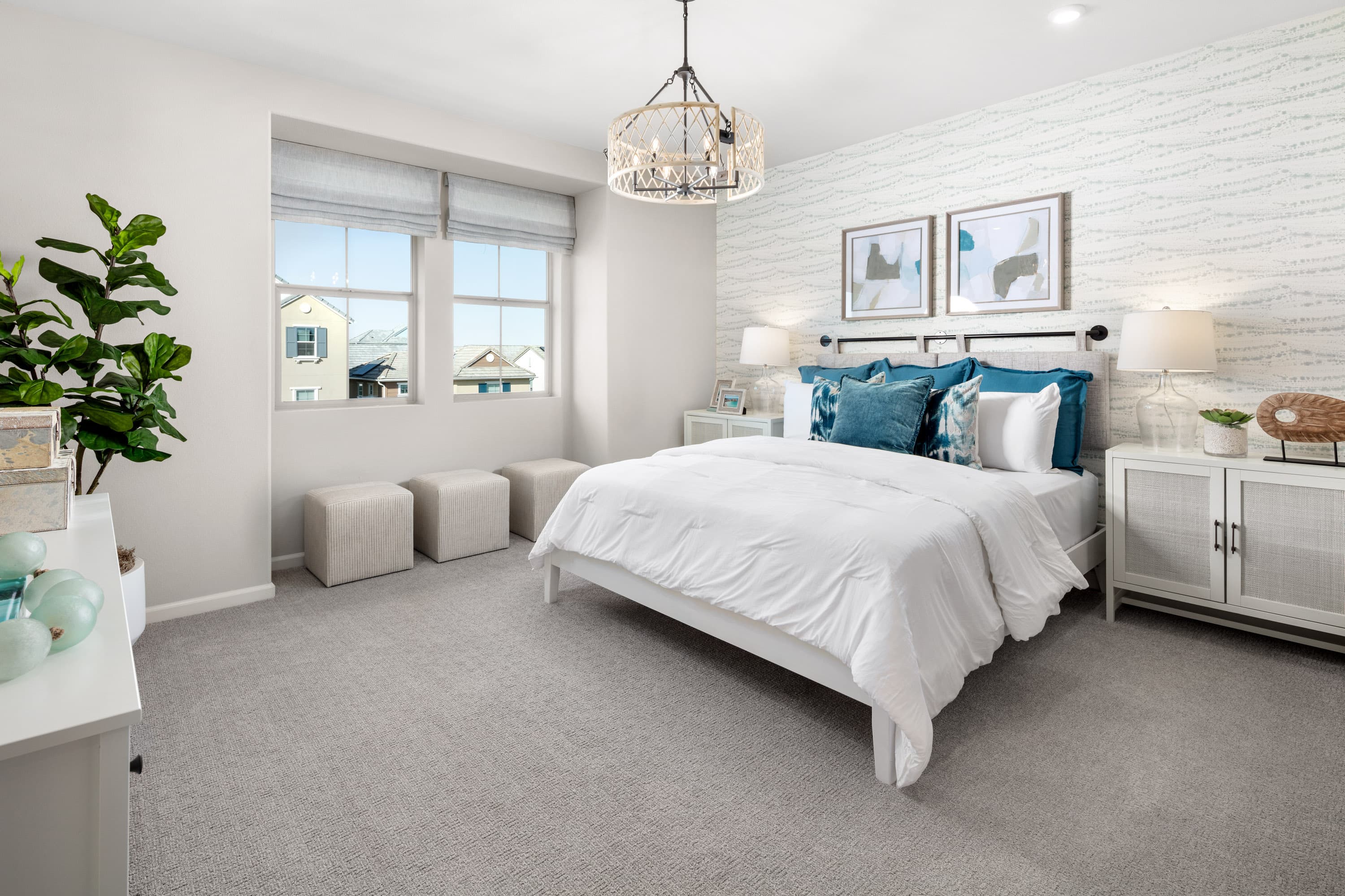 primary bedroom with king-sized bed and carpet