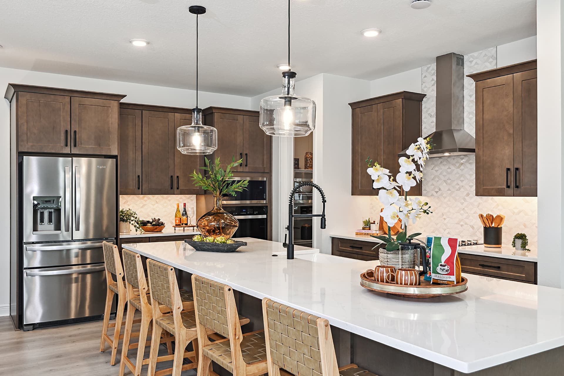 kitchen with brown cabinets and quartz countertops