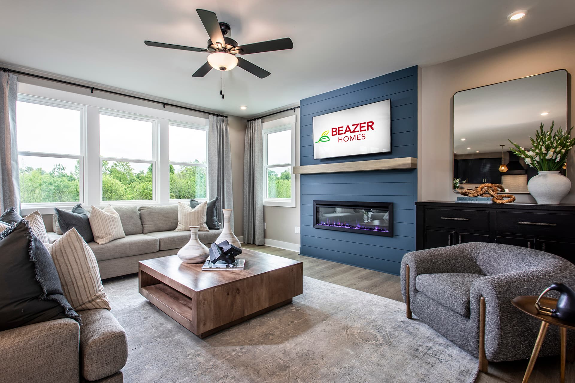 great room with hard-surface flooring & fireplace