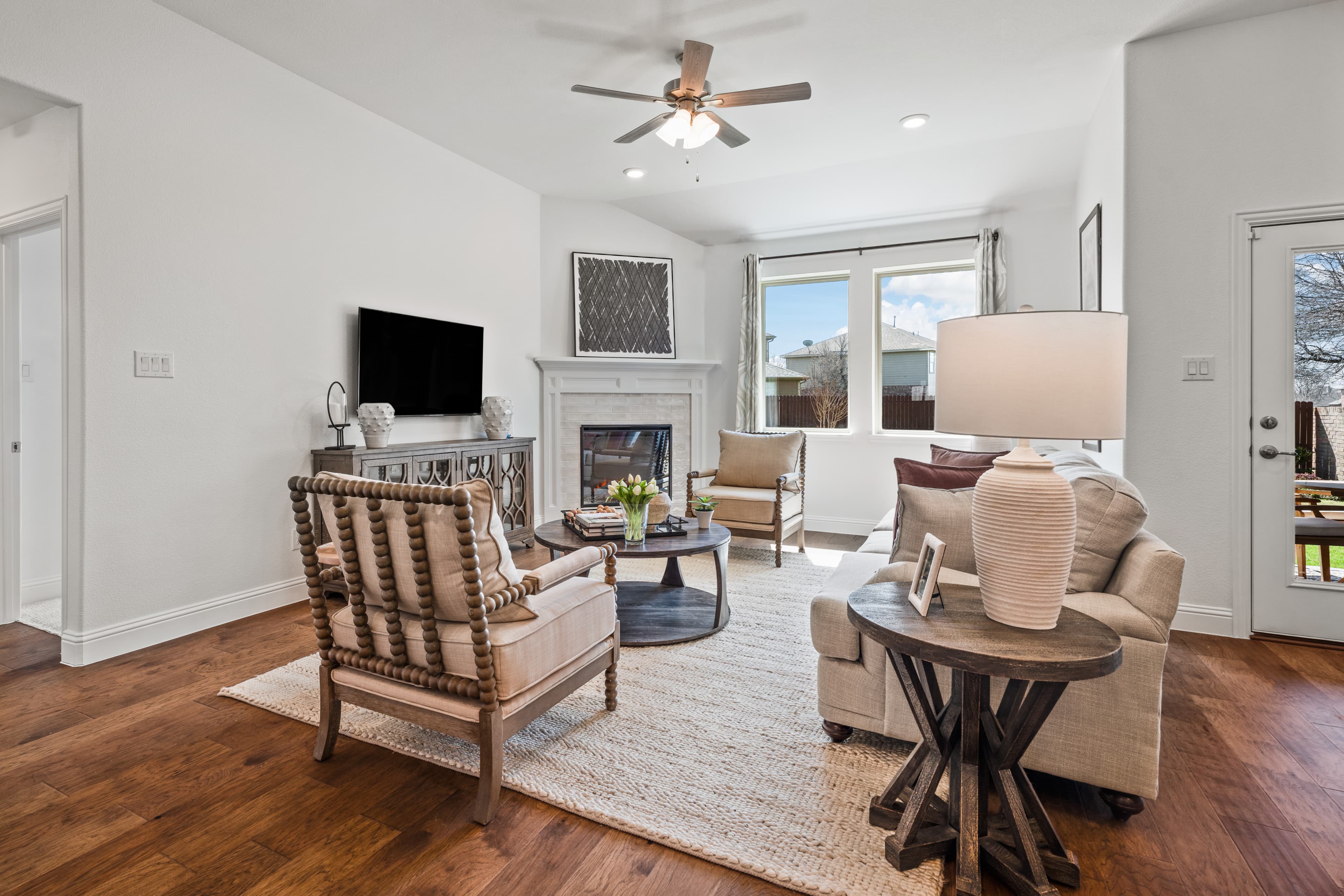 open-concept great room with electric fireplace