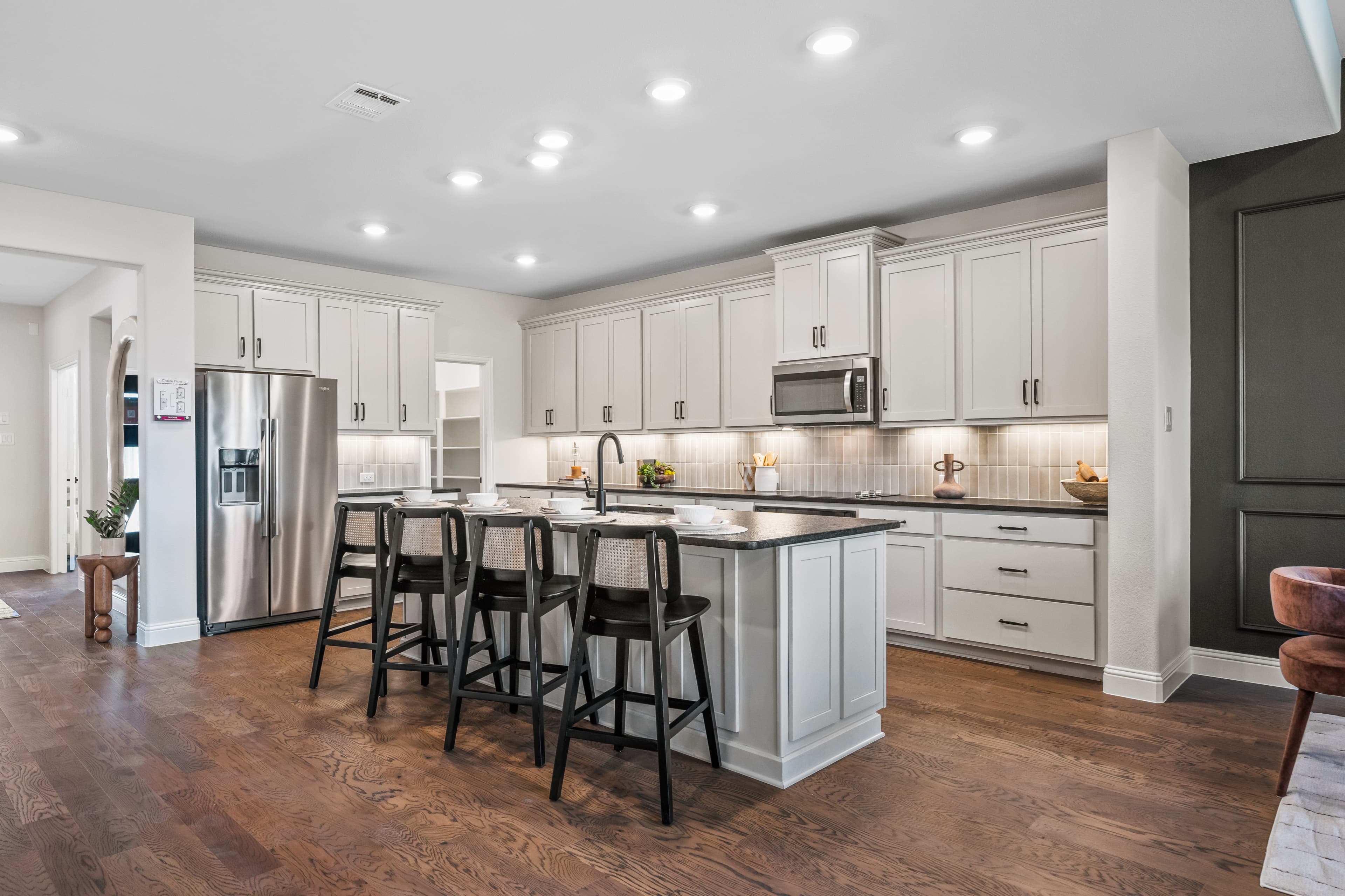 open kitchen with cabinets and large island 