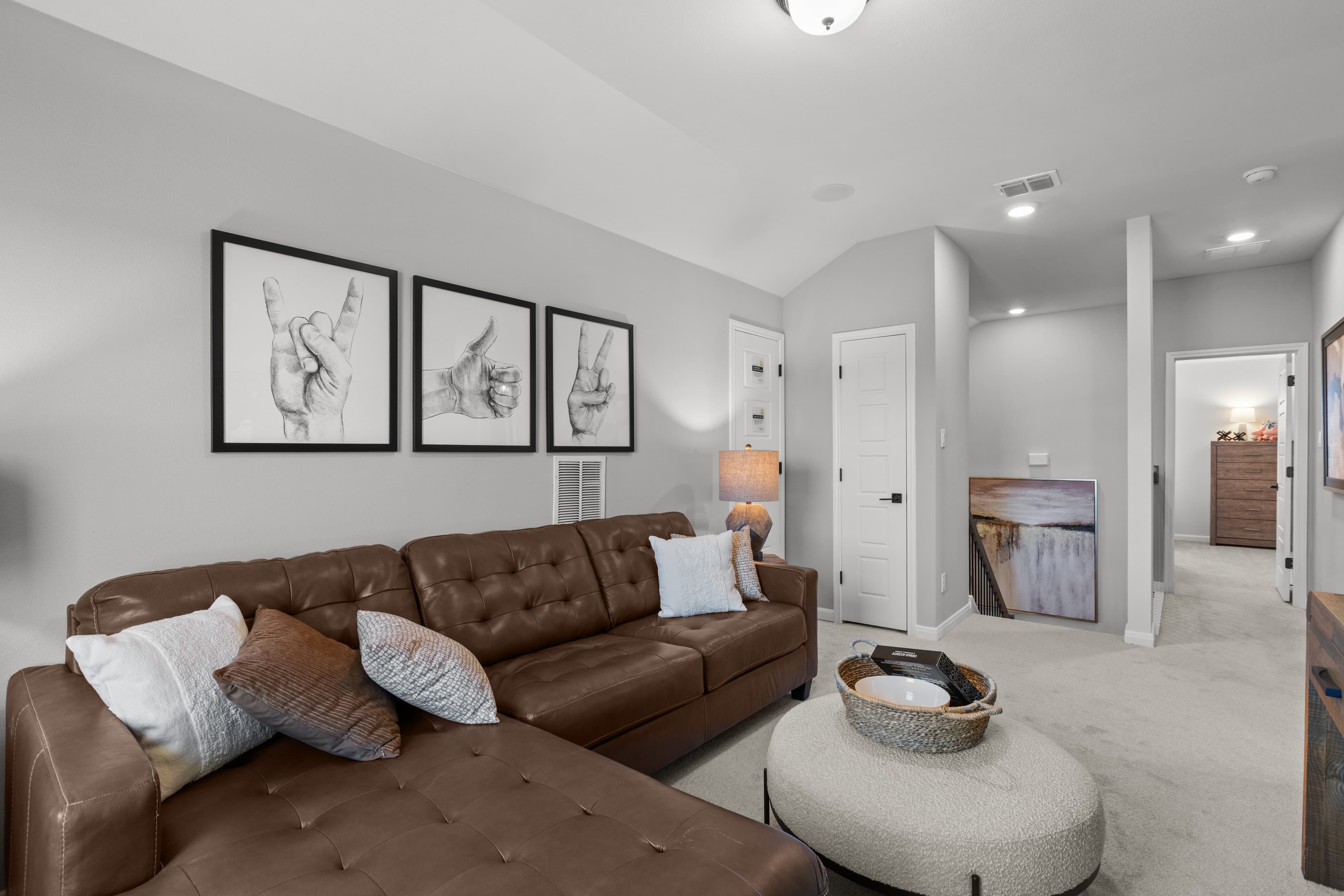 loft with brown couches, carpet & ottoman