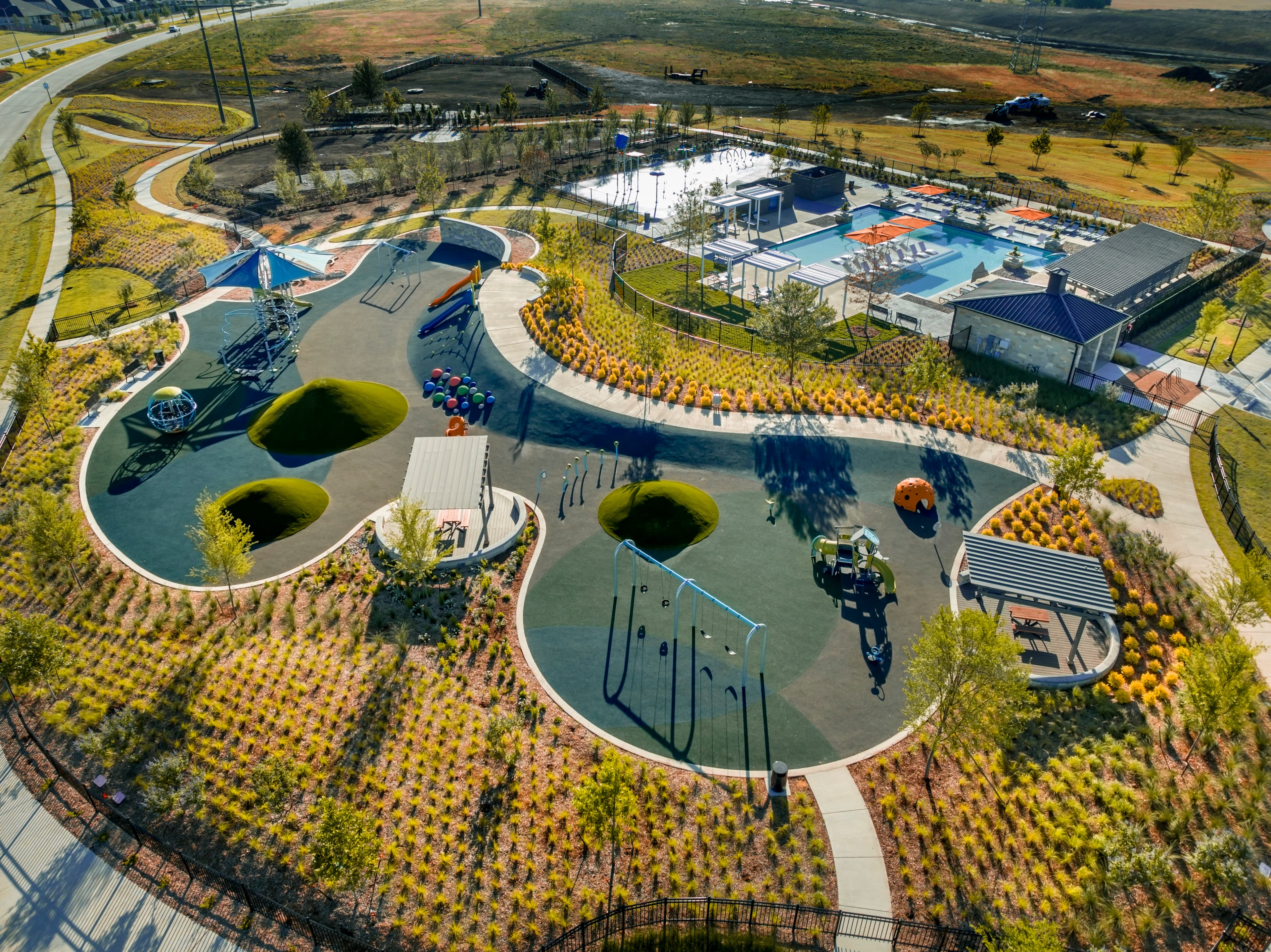 community pool, splashpad, playground and dog park