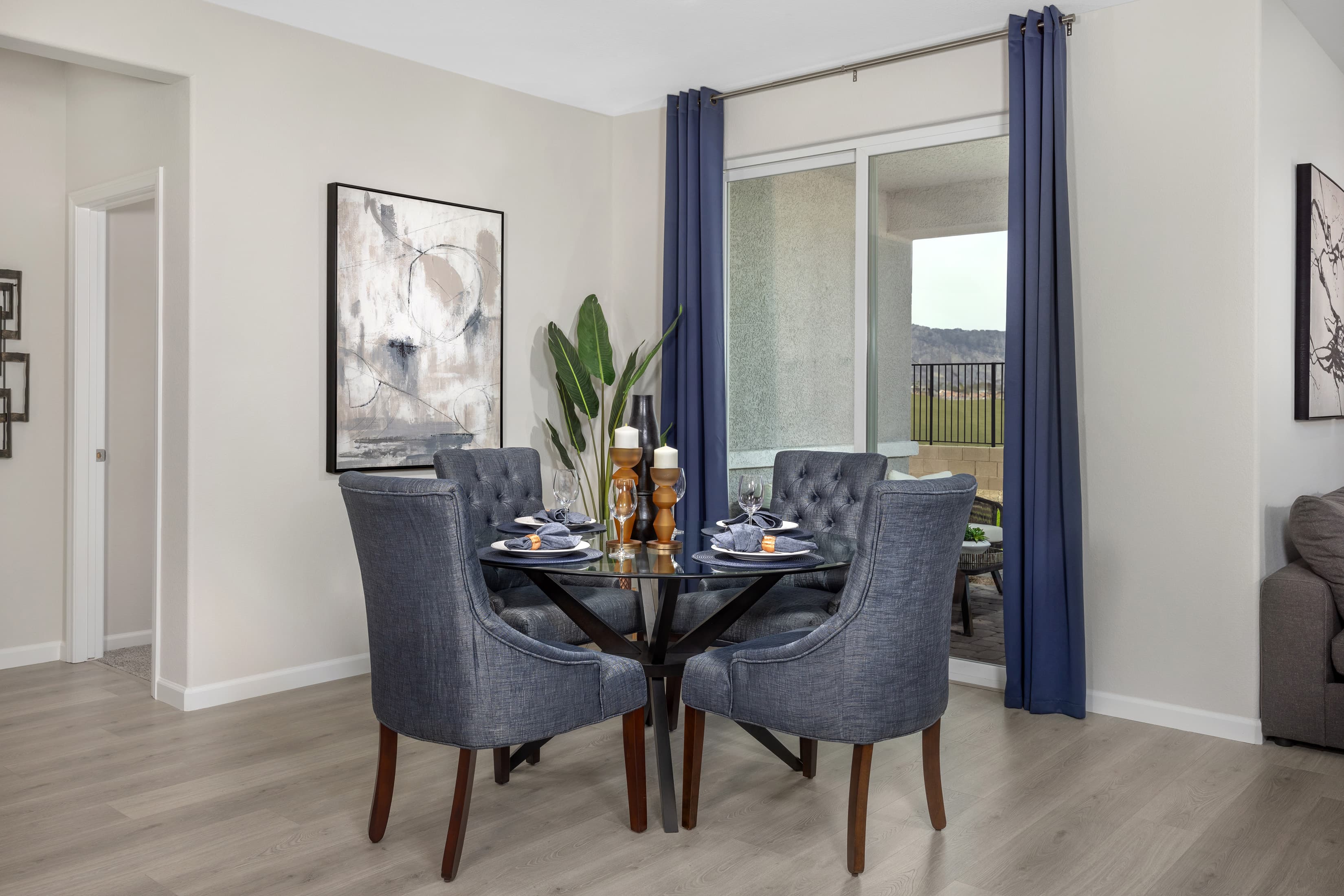 dining room with laminate wood flooring and table