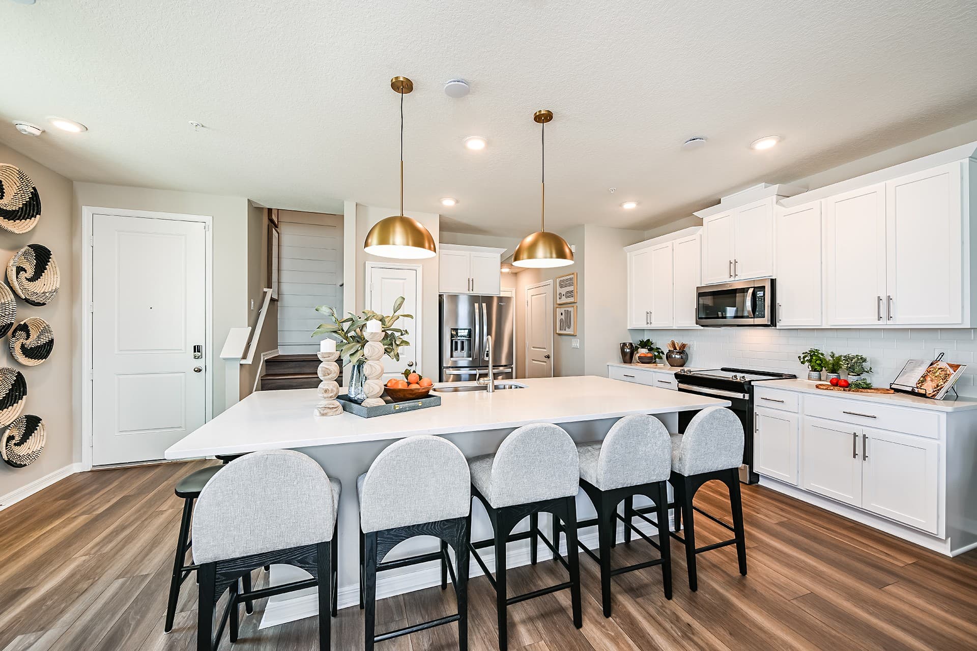 kitchen with white cabinets and large island