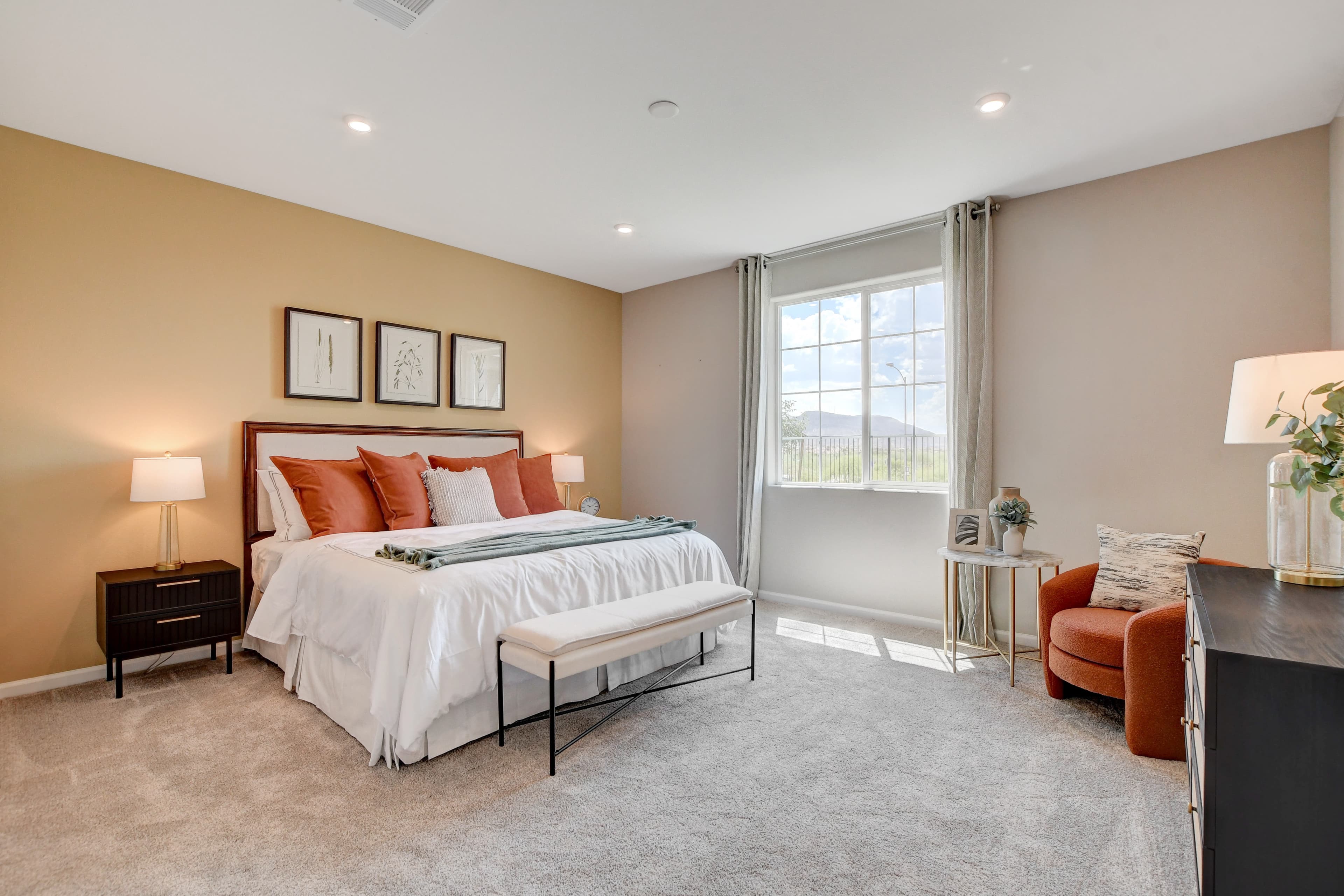 primary bedroom with bed and large window
