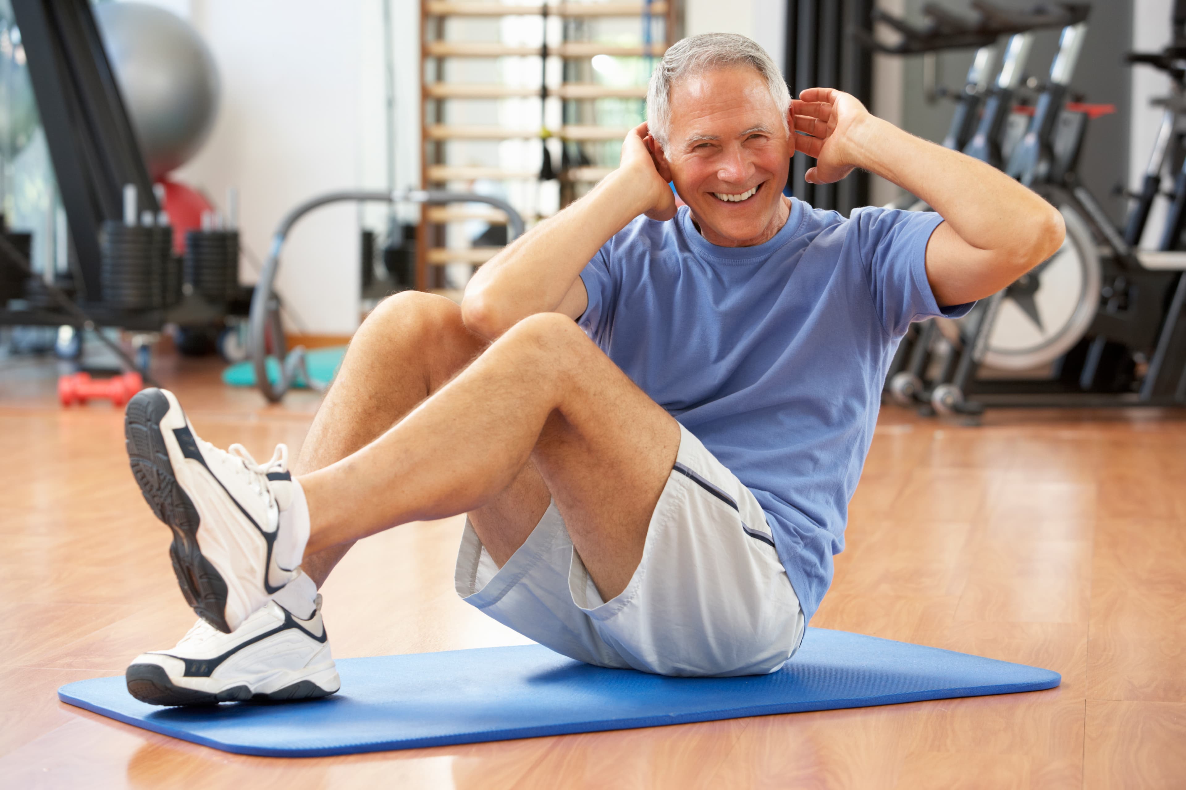 man doing crunches on a mat