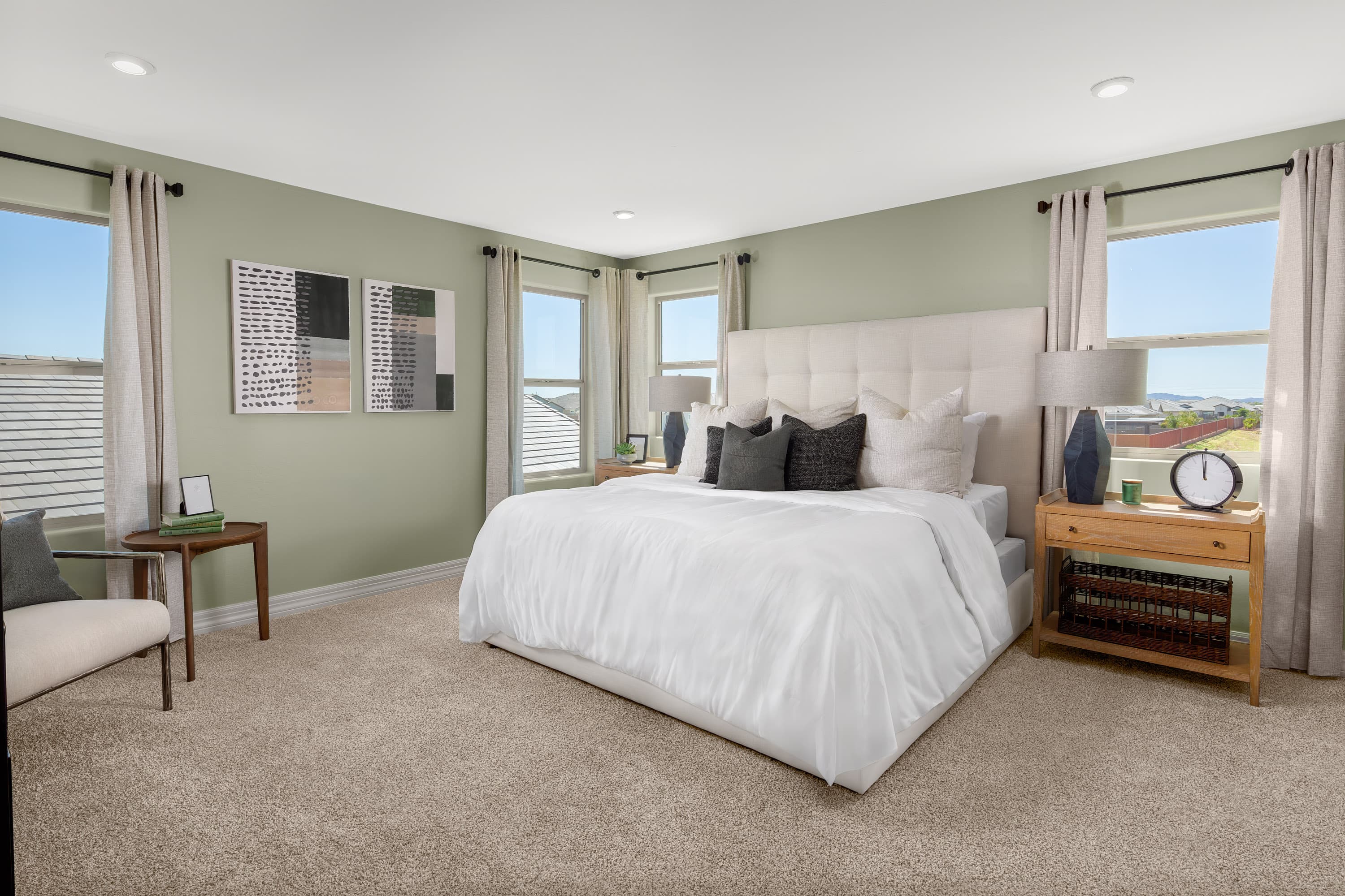 spacious main bedroom with several windows