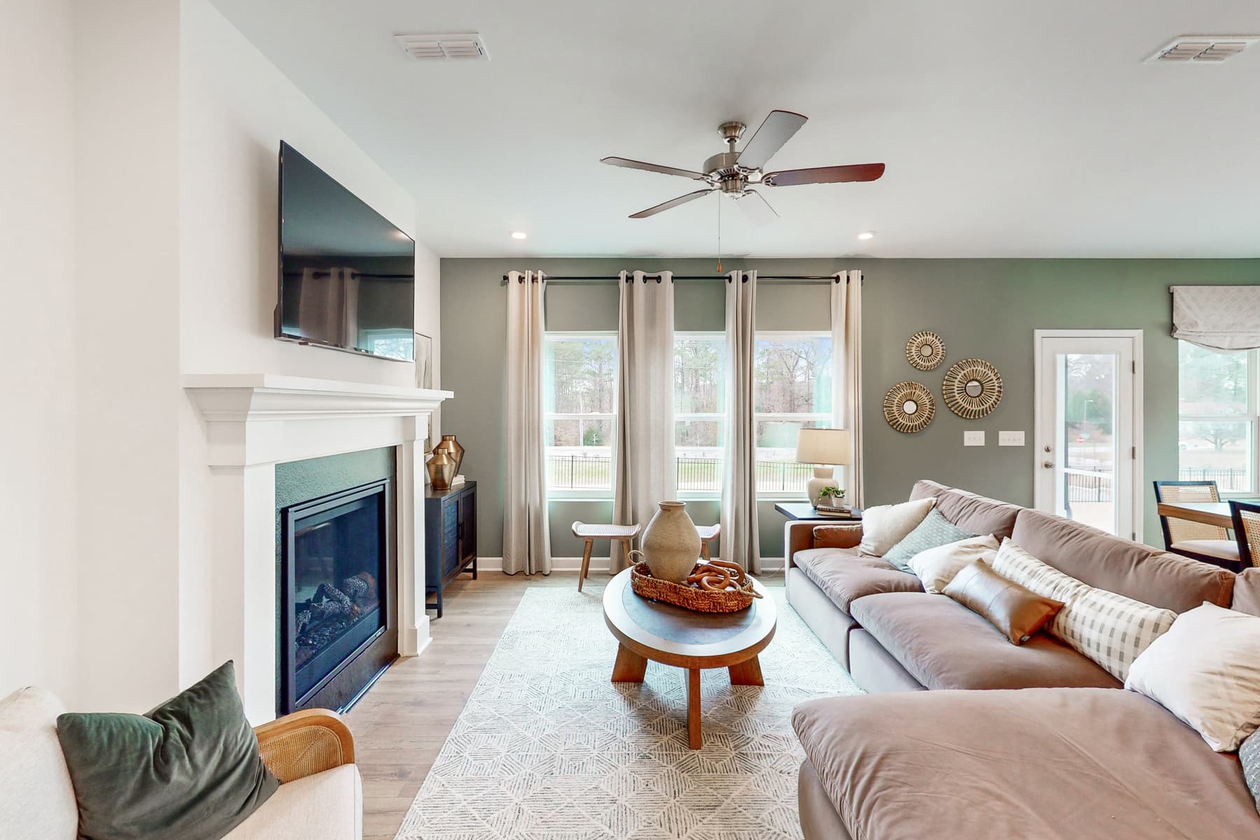 great room with fireplace and mounted tv above