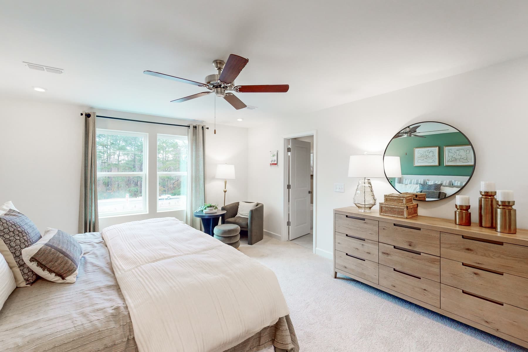 large bedroom with king bed and dresser