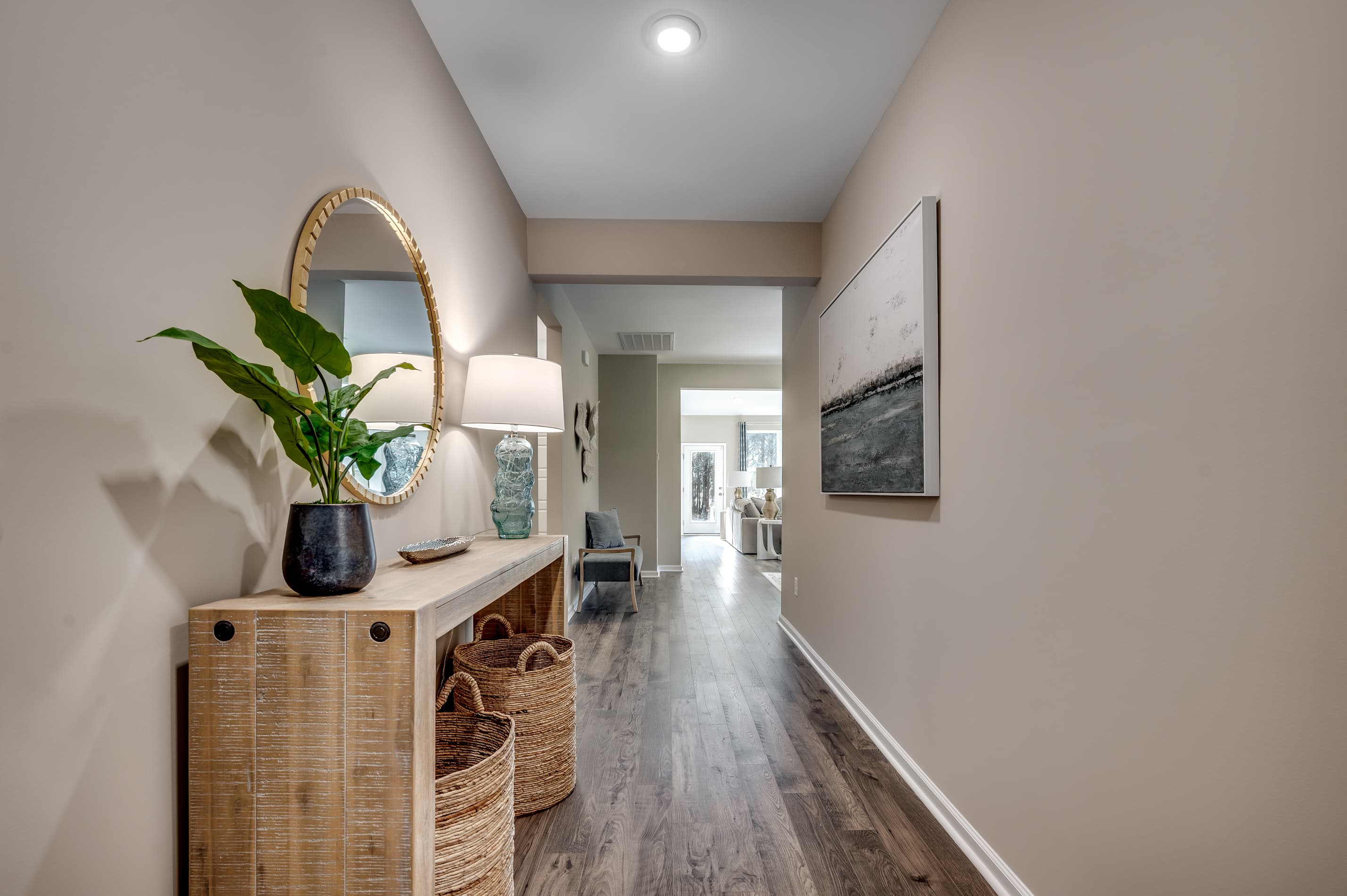 tan walls and white trim with hardwood floors