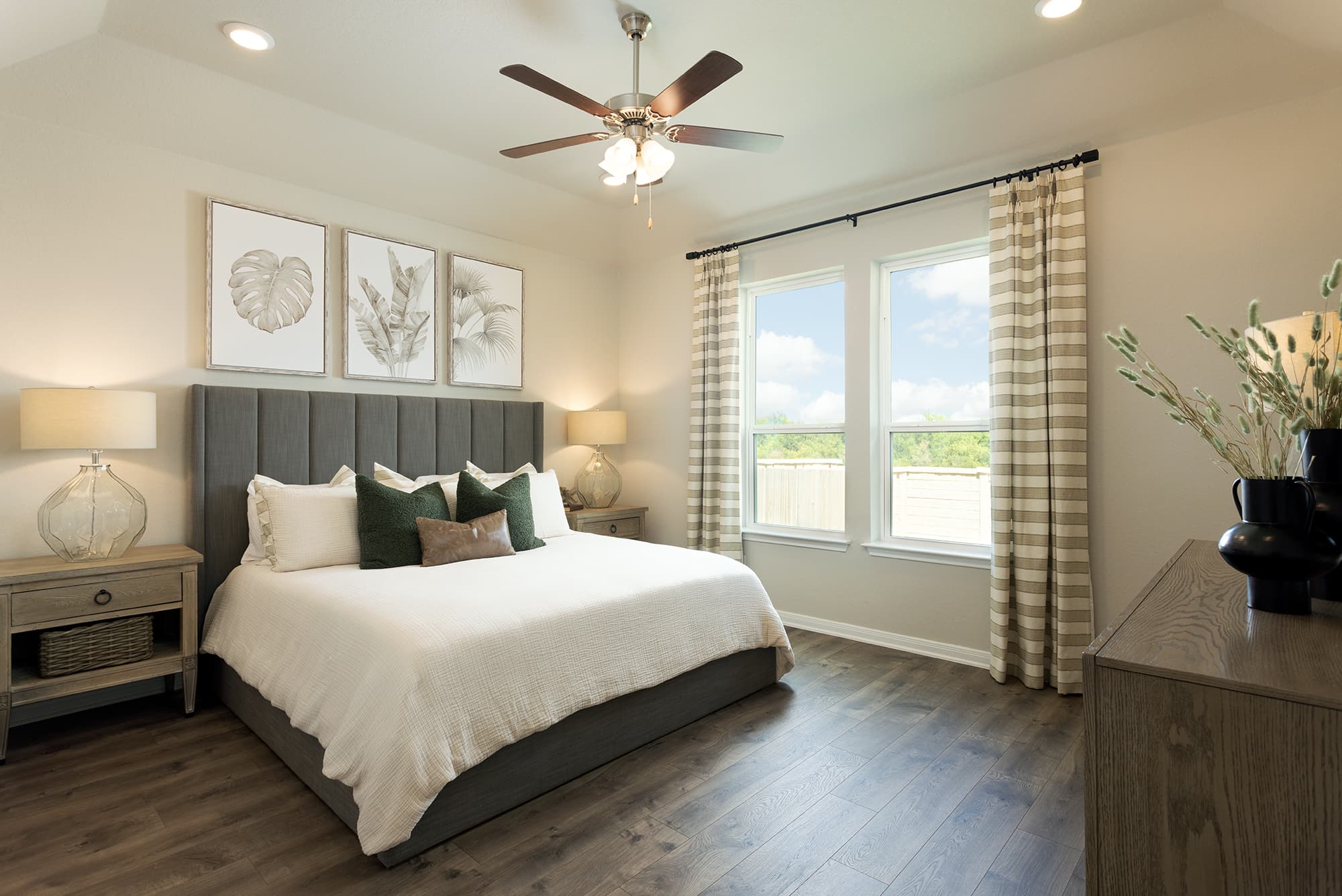 bedroom with wood floor, ceiling fan & window 