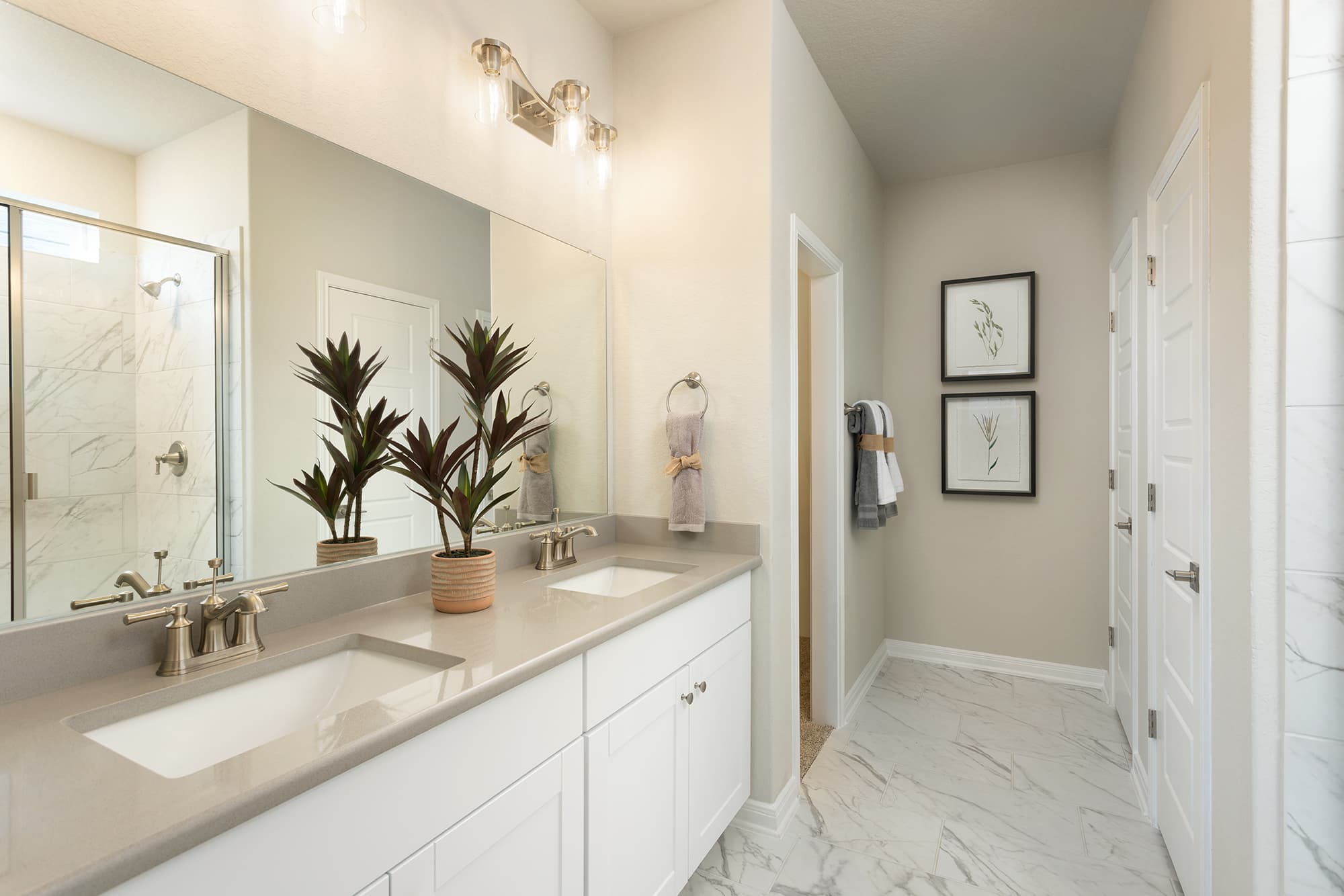 bathroom with a white sink and a walk-in shower 