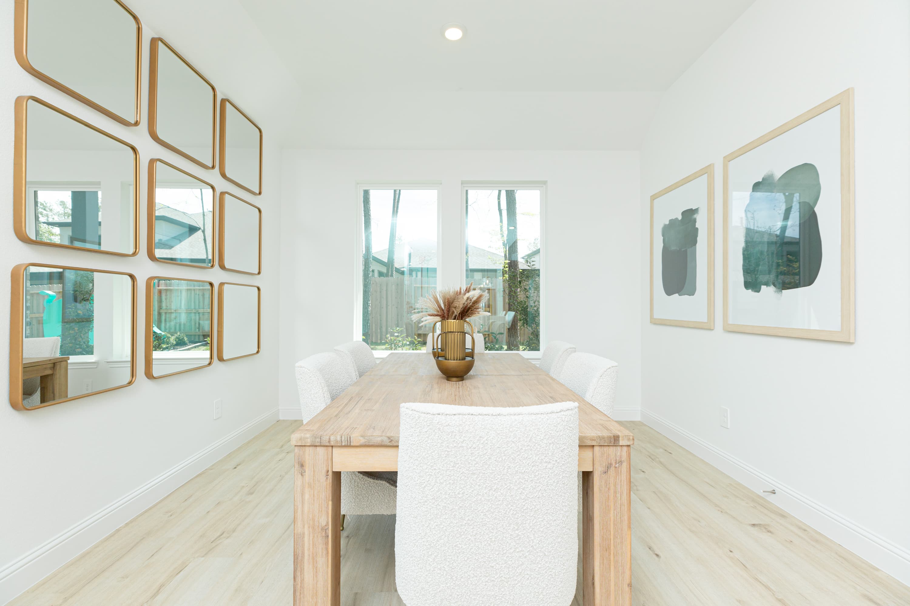 wooden dining table with chairs and mirror decor