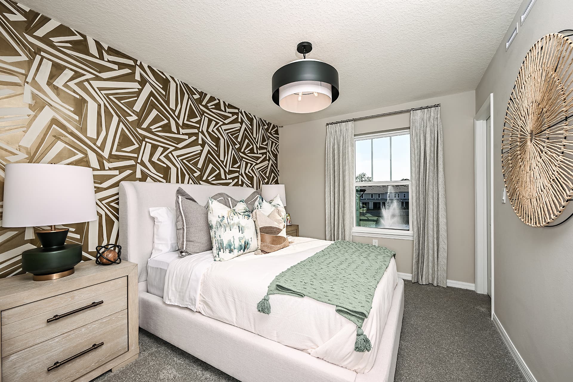 secondary bedroom with white bed and carpet
