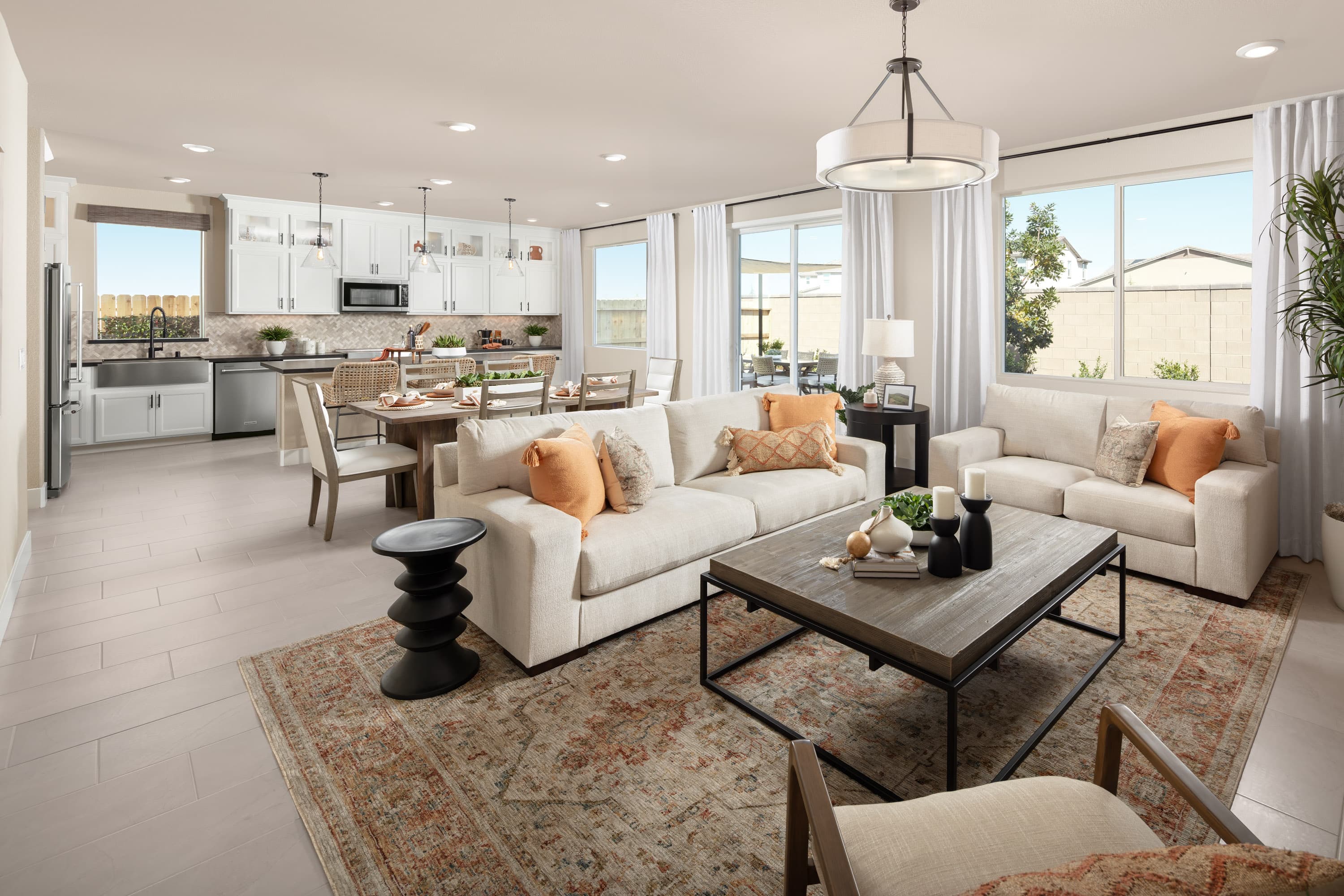 great room with two white sofas, and windows