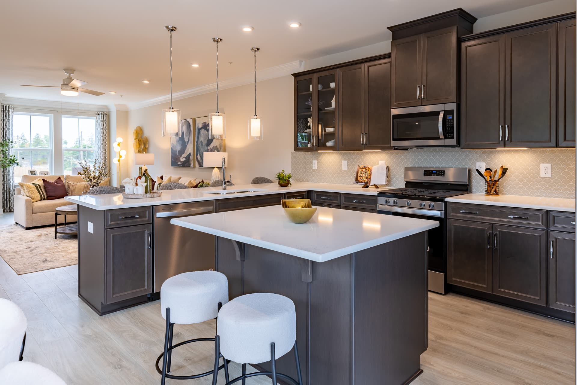 kitchen with dark cabinets and light countertops