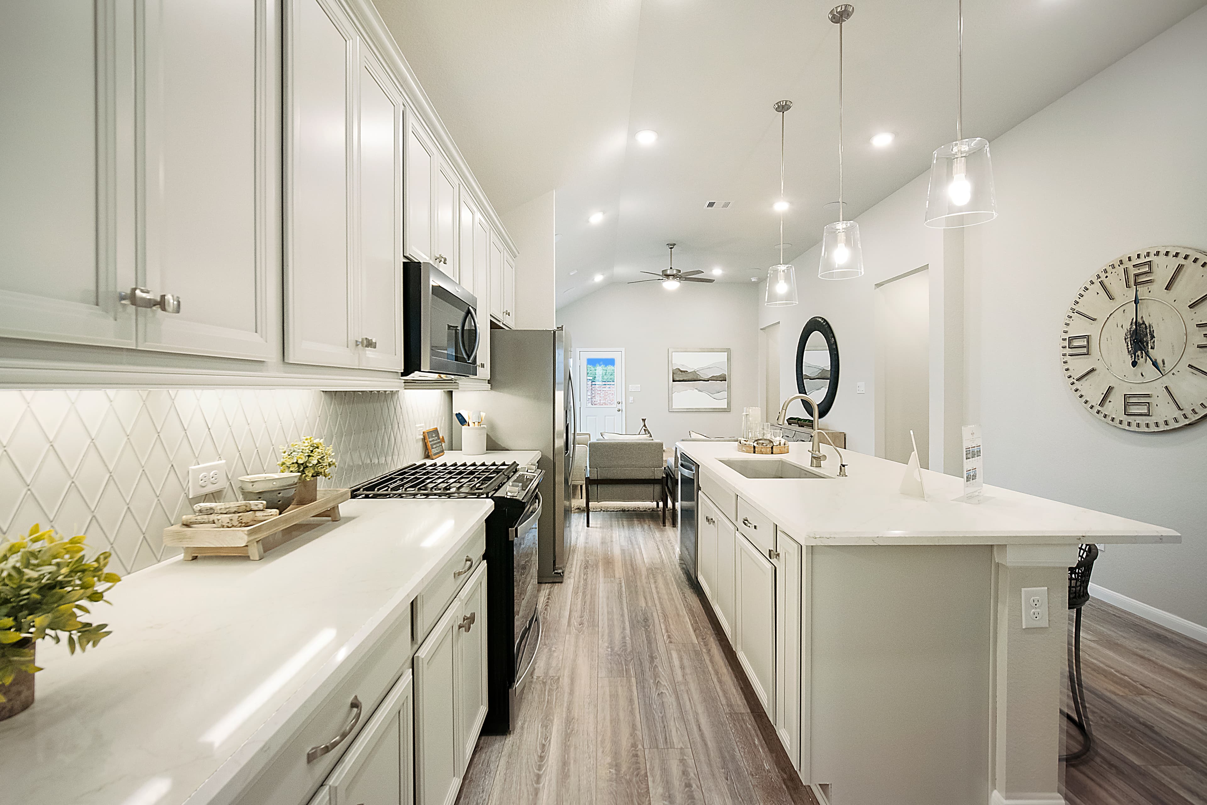 kitchen with glass pendant lighting and backsplash