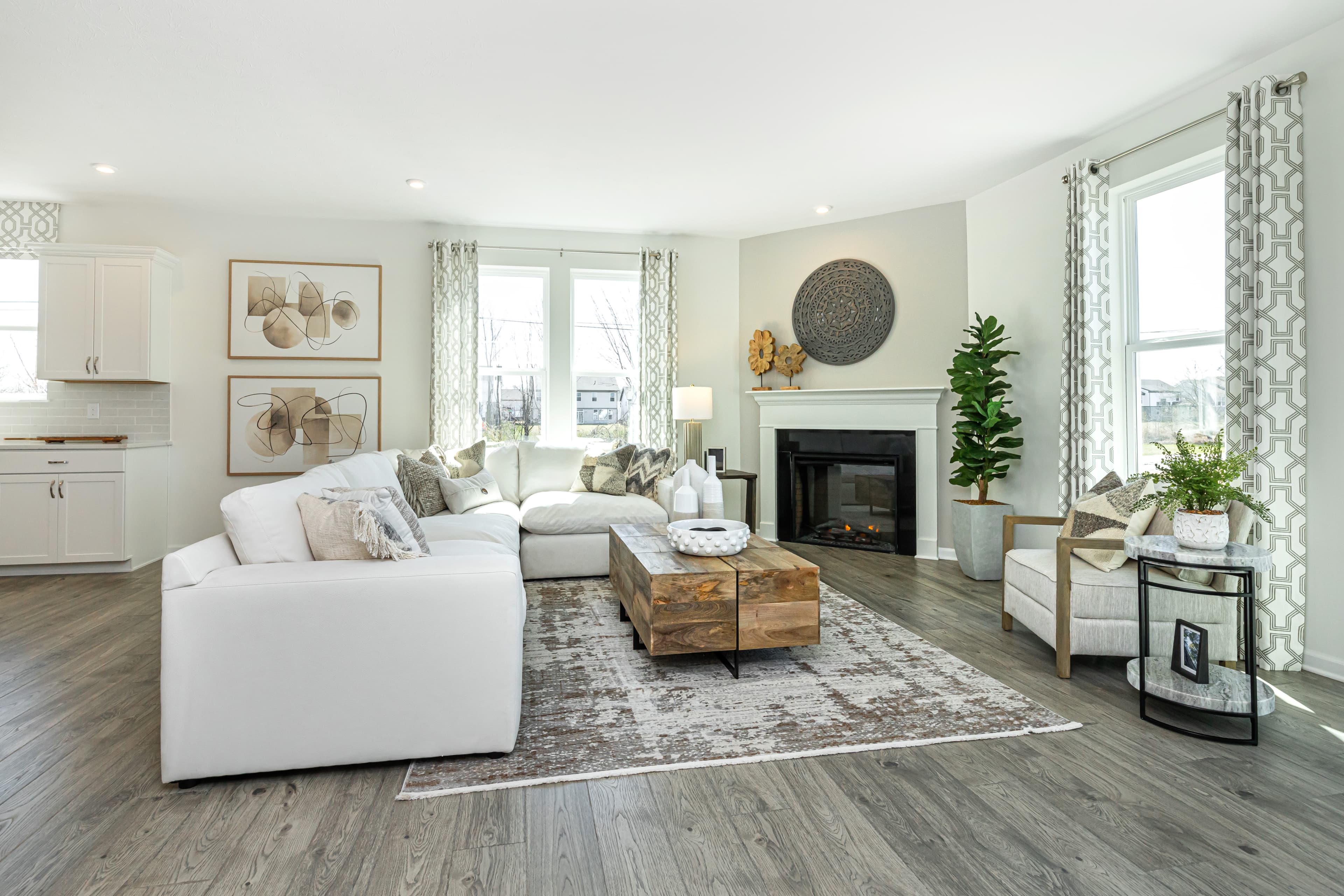 great room with fireplace and hardwood floors 