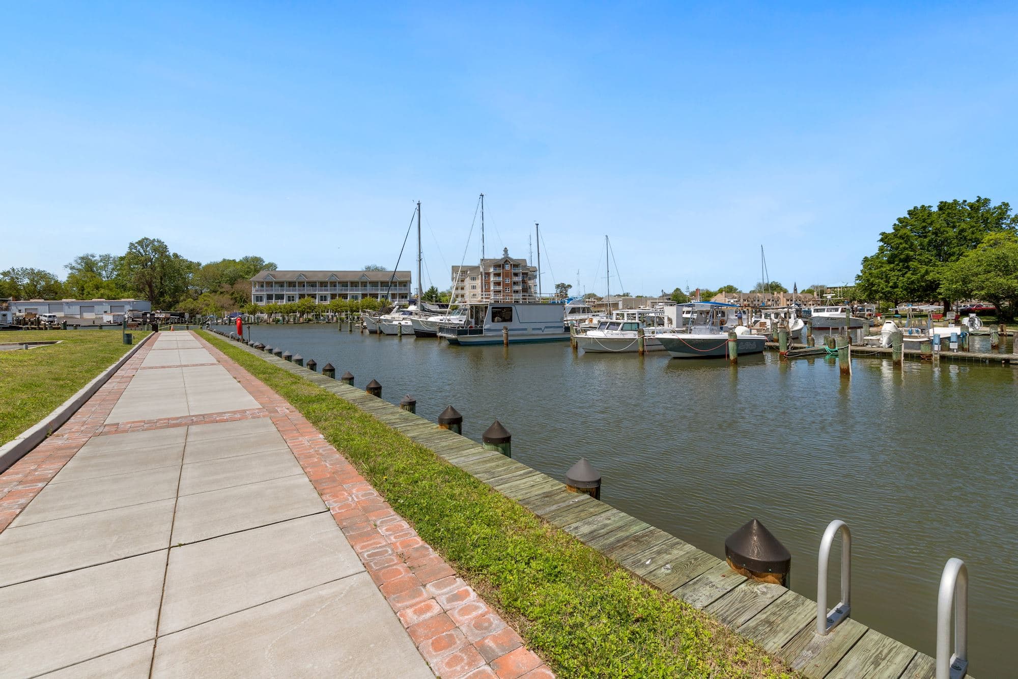 community riverwalk lines the marina