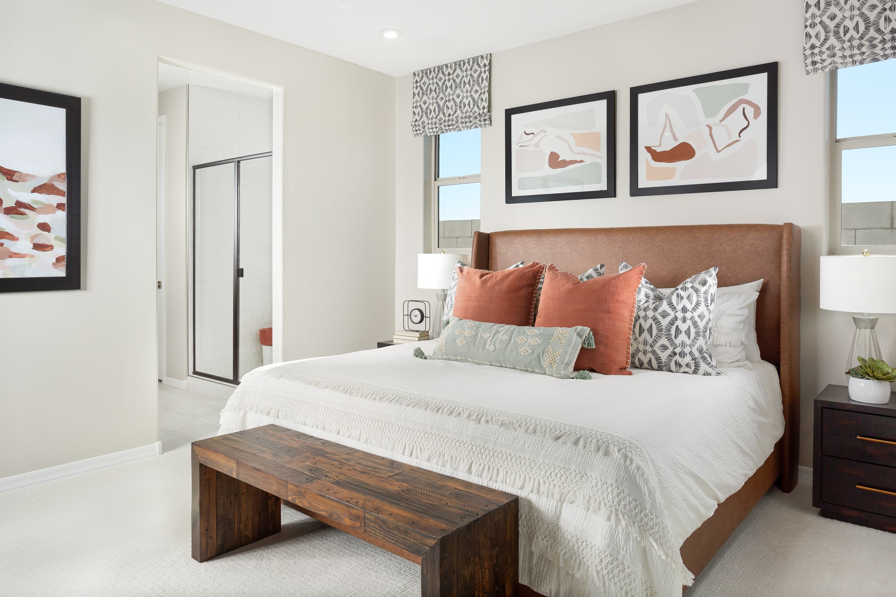 primary bedroom with bed and side tables
