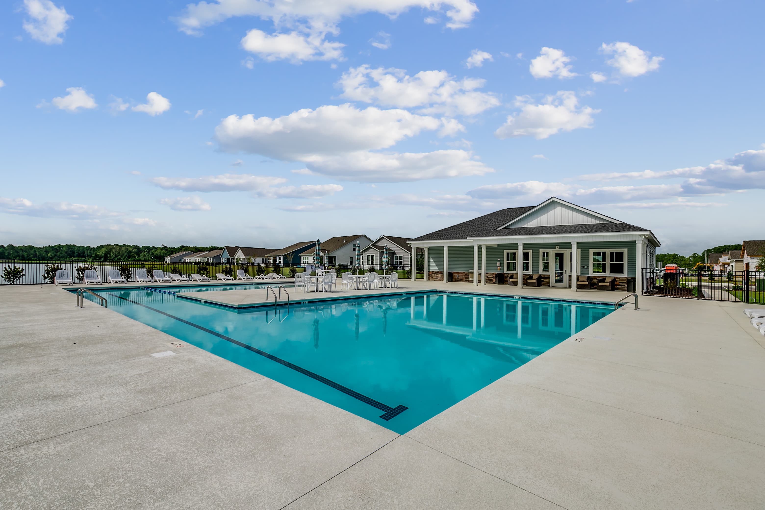 refreshing swimming pool with lounge chairs